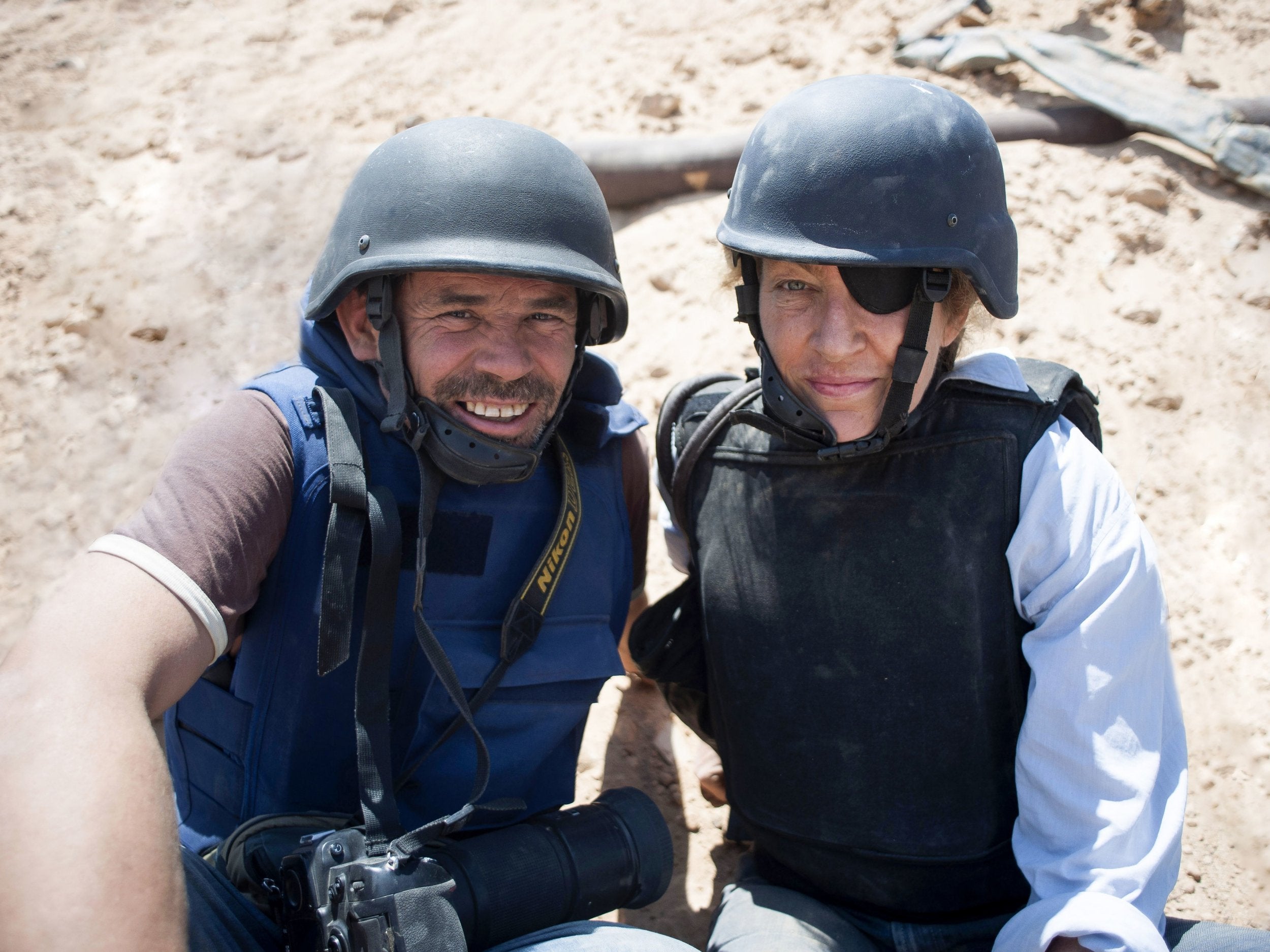 War photographer Paul Conroy, pictured here with Marie Colvin, has said he hopes a new documentary, Under the Wire, which captures the death of journalist Colvin, injects a sense of shame into the Syrian regime