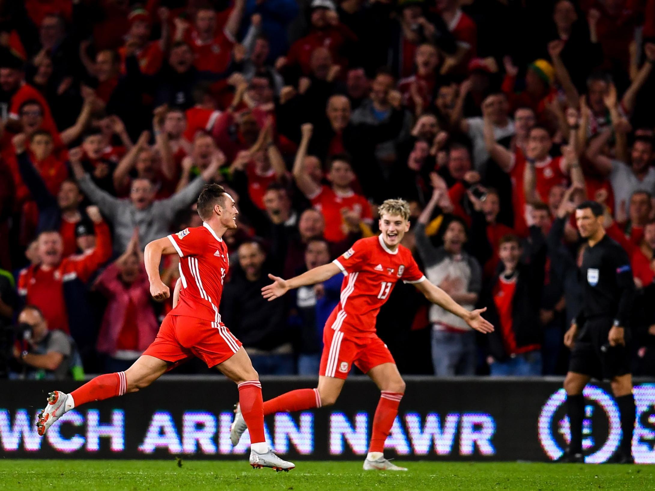 Youngsters Roberts, 22, celebrates with Brooks, 21, after scoring his side’s fourth goal