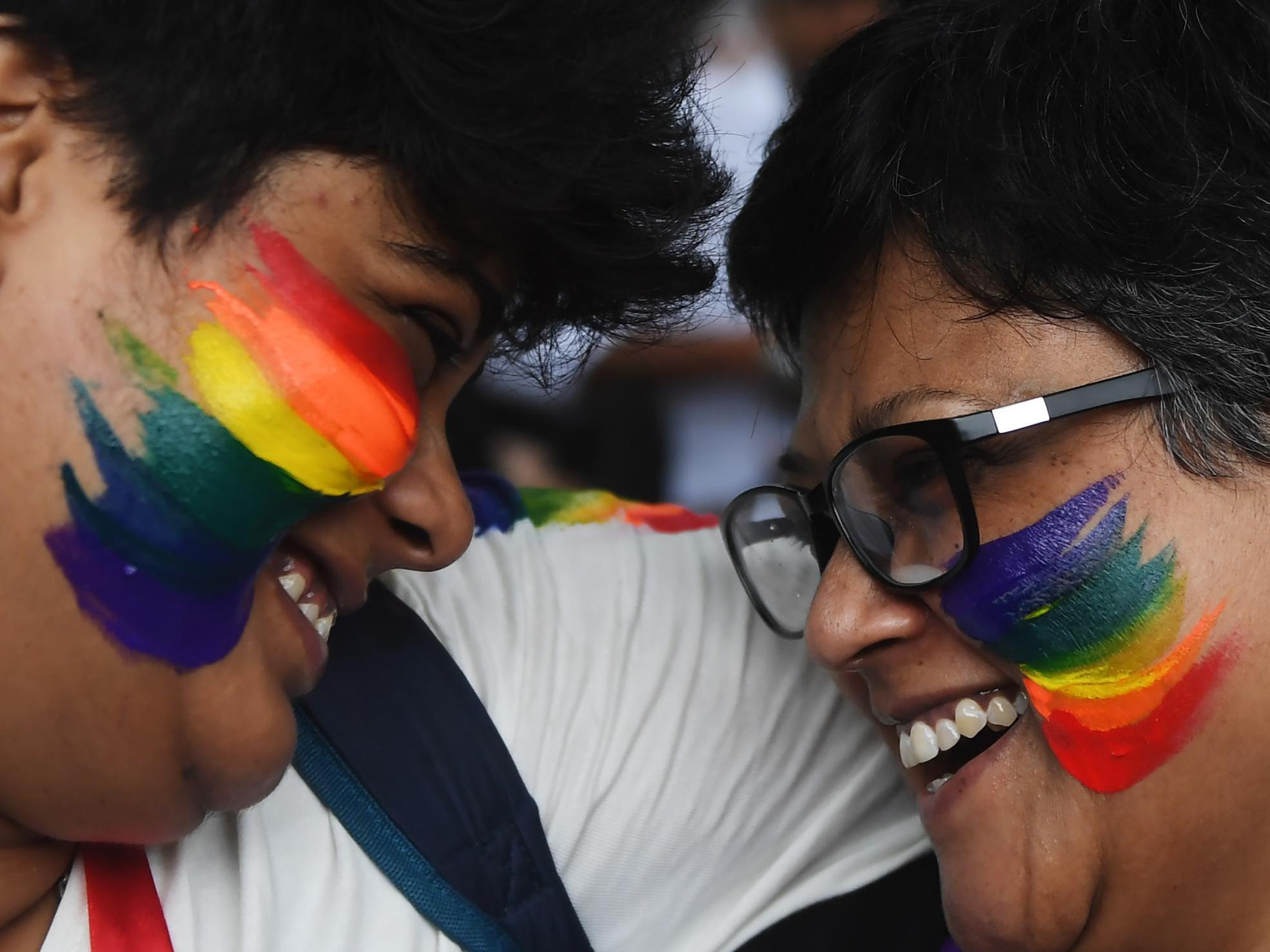 Two women in India celebrate a Supreme Court decision in September to strike down a colonial-era ban on gay sex