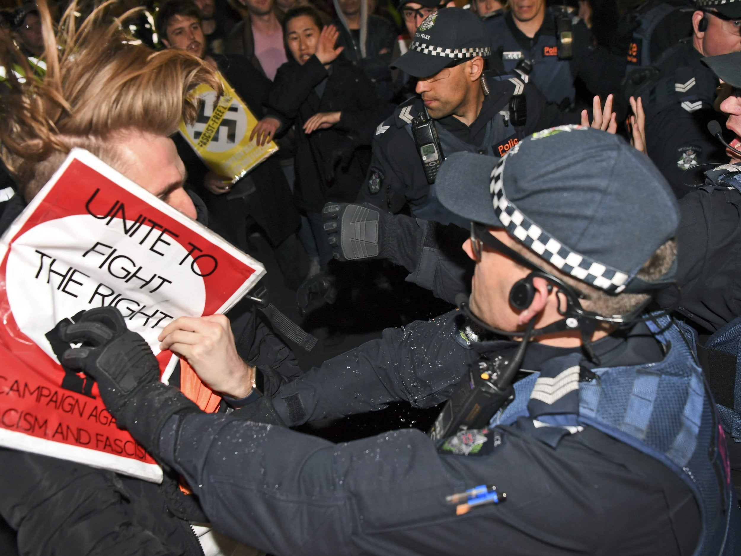 Protesters clash with police outside the function