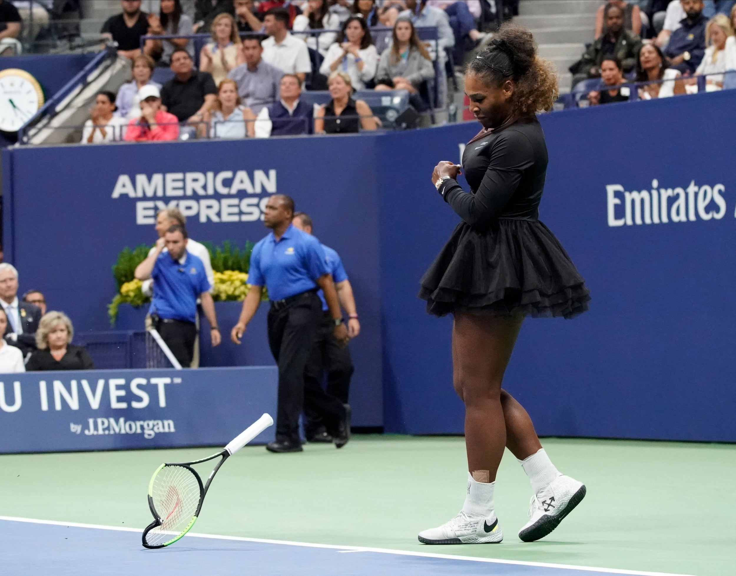 The American smashes her racquet in anger during the controversial second set