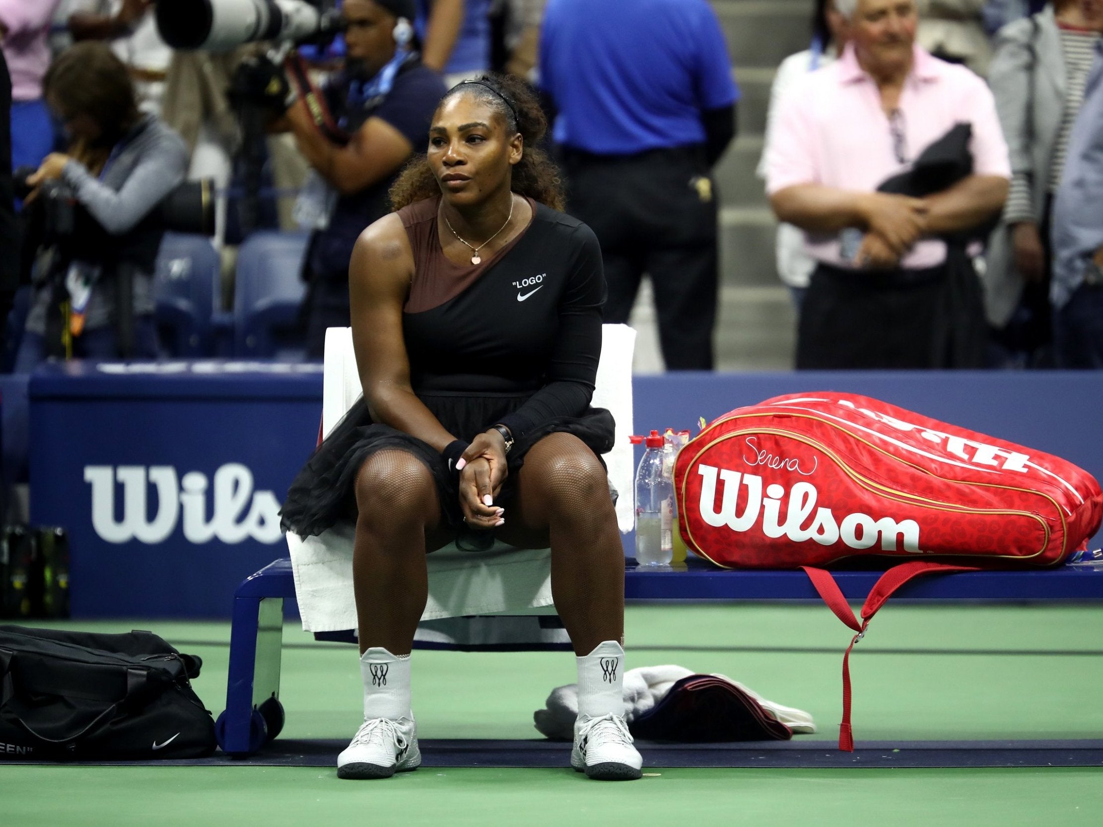 Serena Williams looks on after suffering defeat