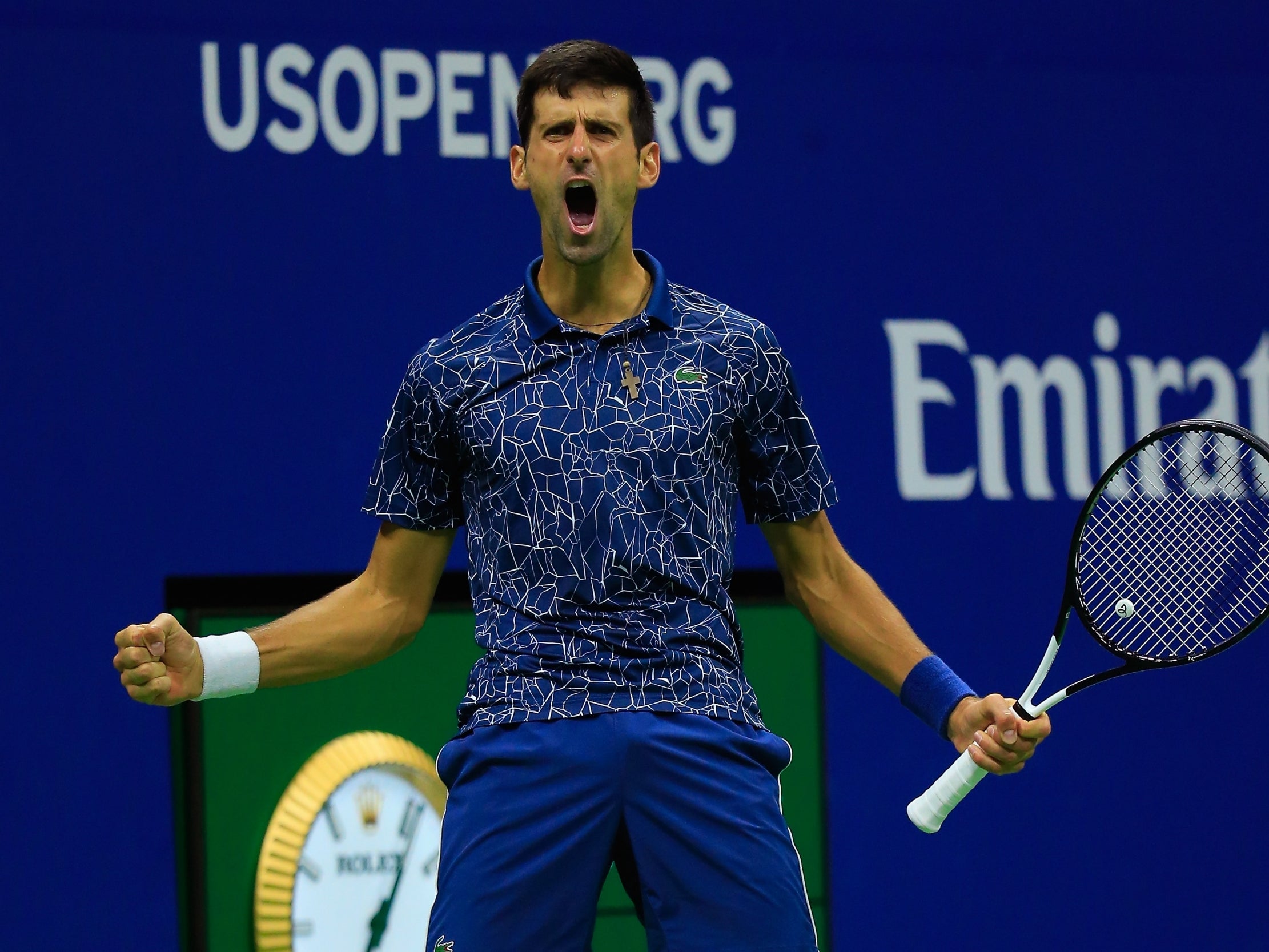 Djokovic celebrates after clinching the third set 6-3, winning the title in the process