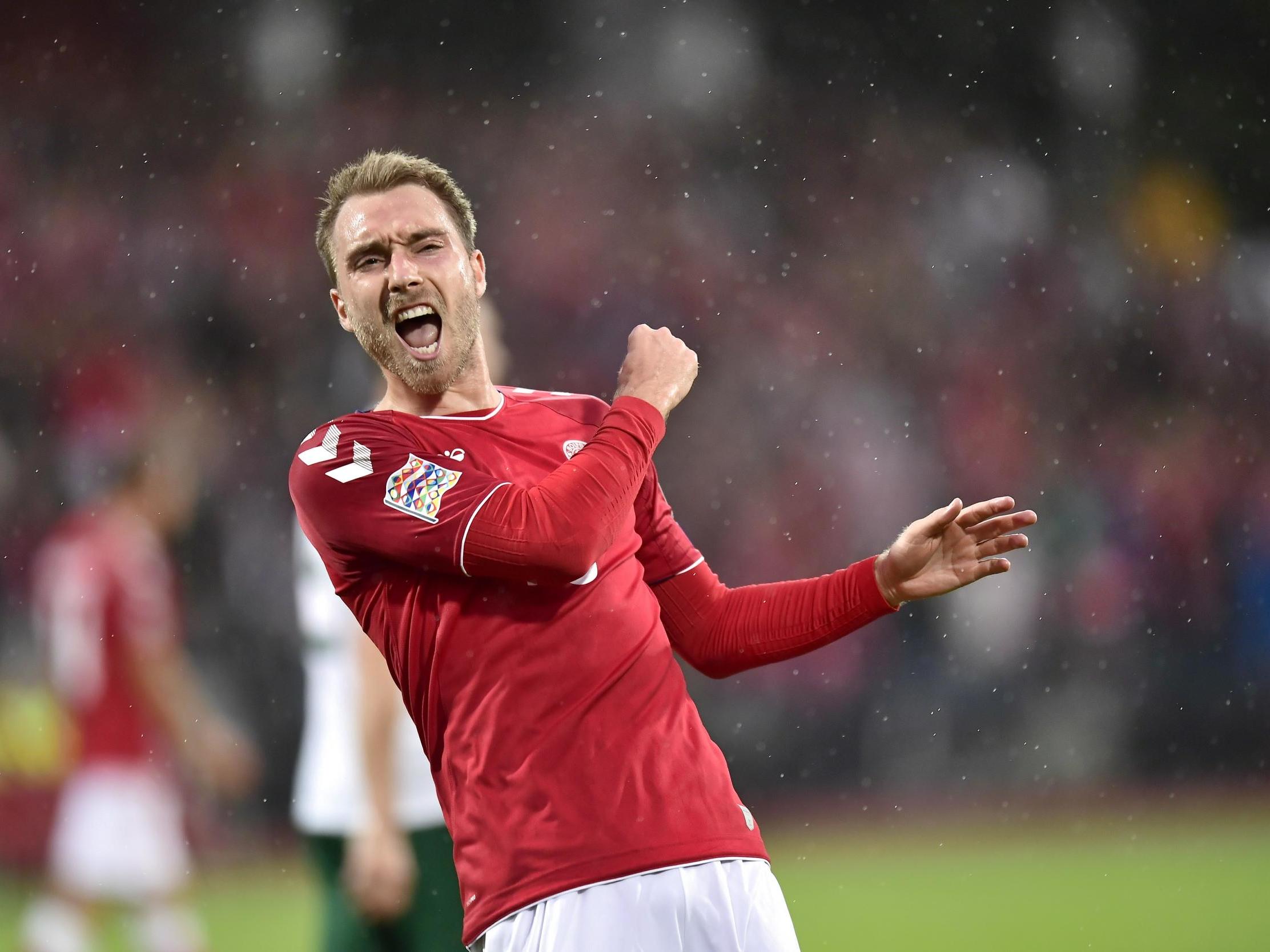 Christian Eriksen celebrates scoring his first against Wales over the weekend