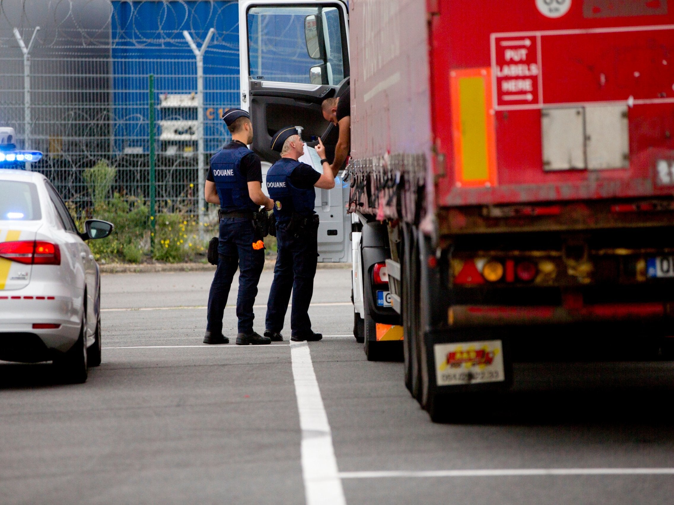 A truck is checked by customs officers at a checkpoint in Zeebrugge