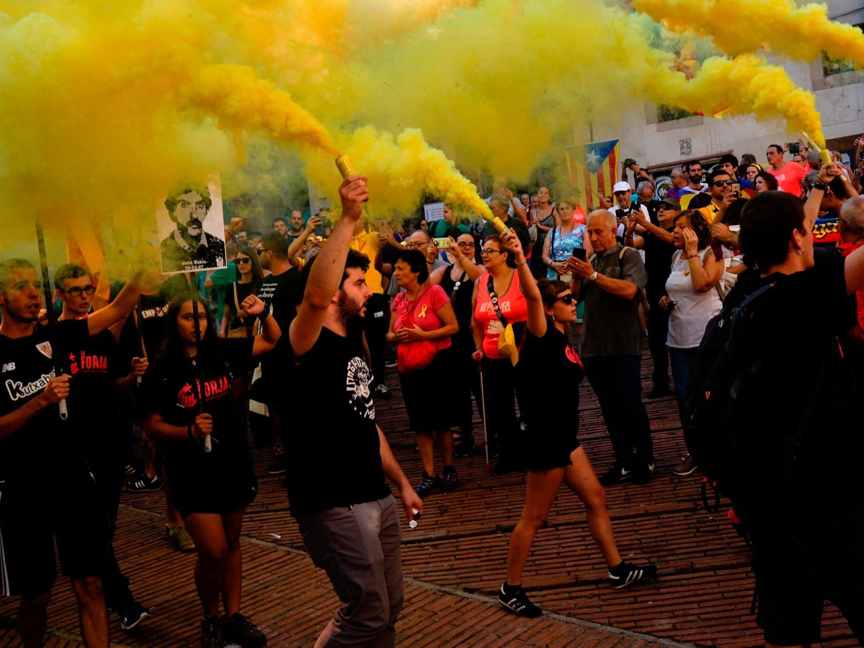 Independence demonstrators march during 'Diada' in Barcelona, where Catalonians are seeking independence from Spain