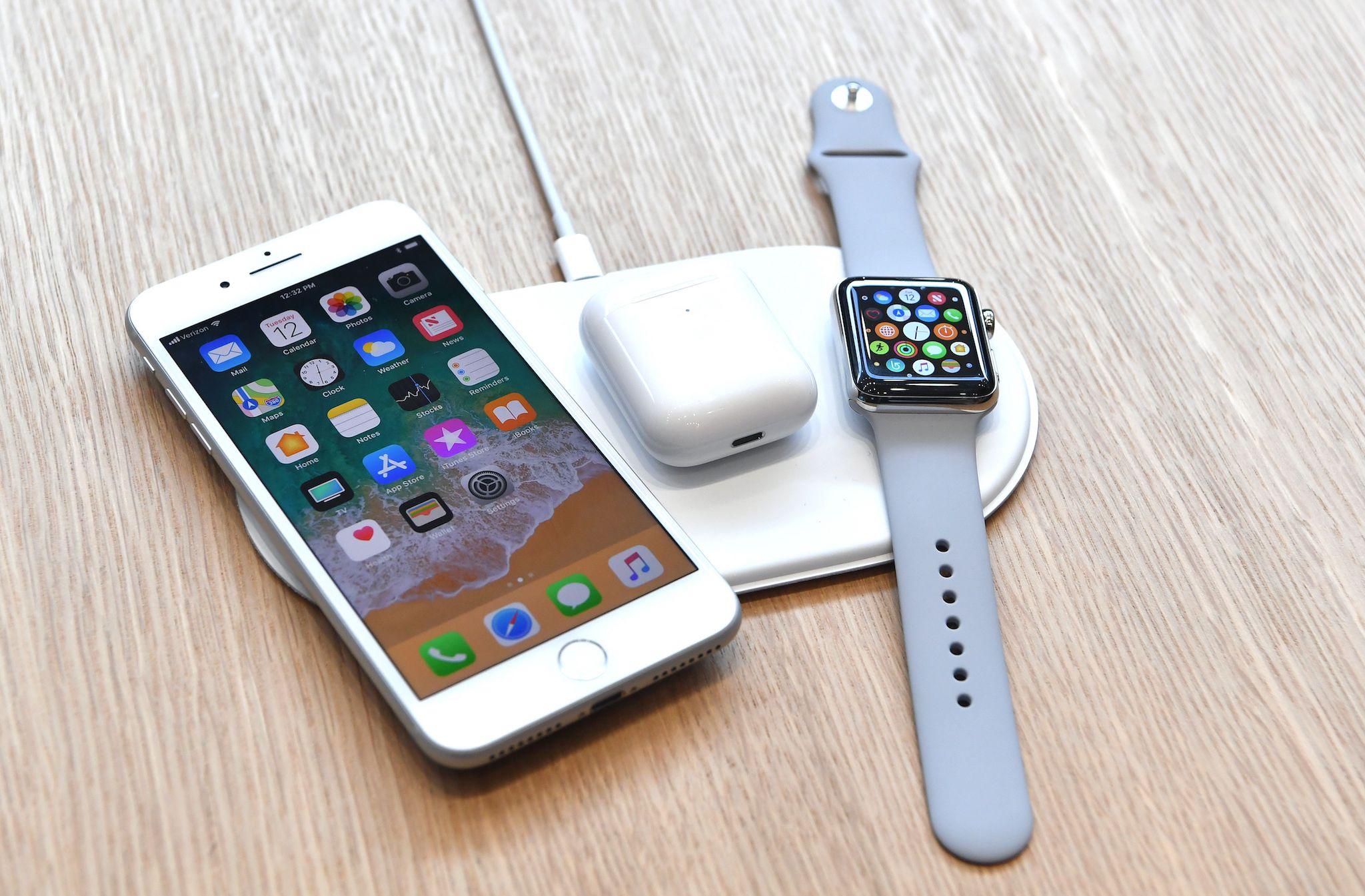 An AirPower mat is seen charging multiple devices during a media event at Apple's new headquarters in Cupertino, California on September 12, 2017