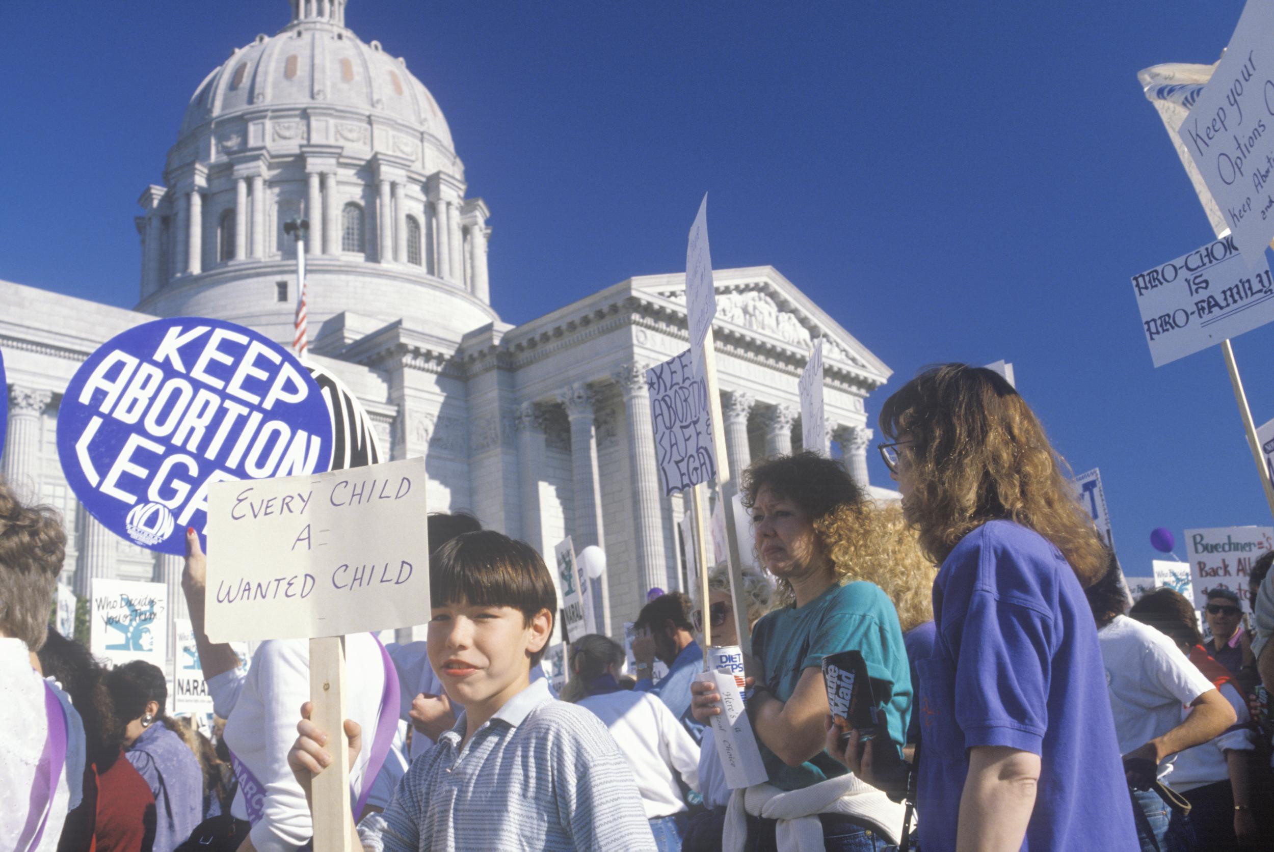 Pro-choice marchers holding signs in Missouri