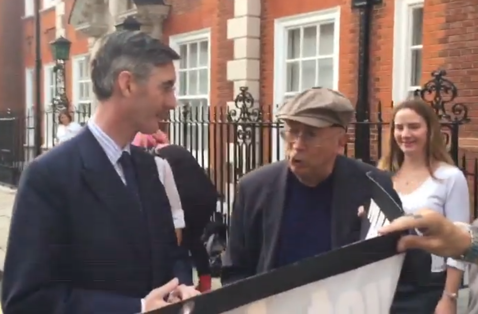 Protester confronts Jacob Rees-Mogg over his employment of a nanny