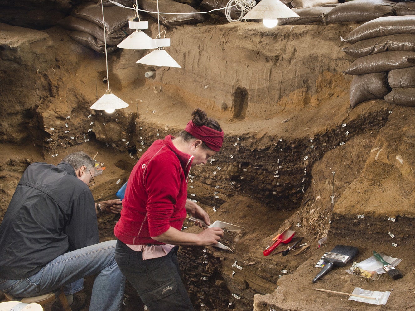 Archaeologists excavating inside Blombos cave