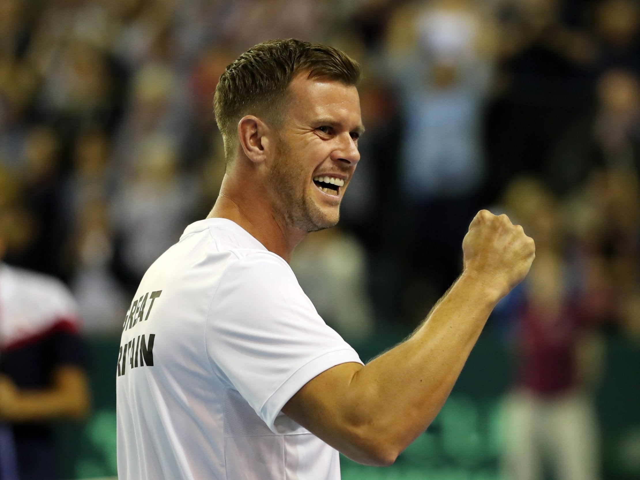 Great Britain captain Leon Smith celebrates Dan Evans' victory over Denis Istomin