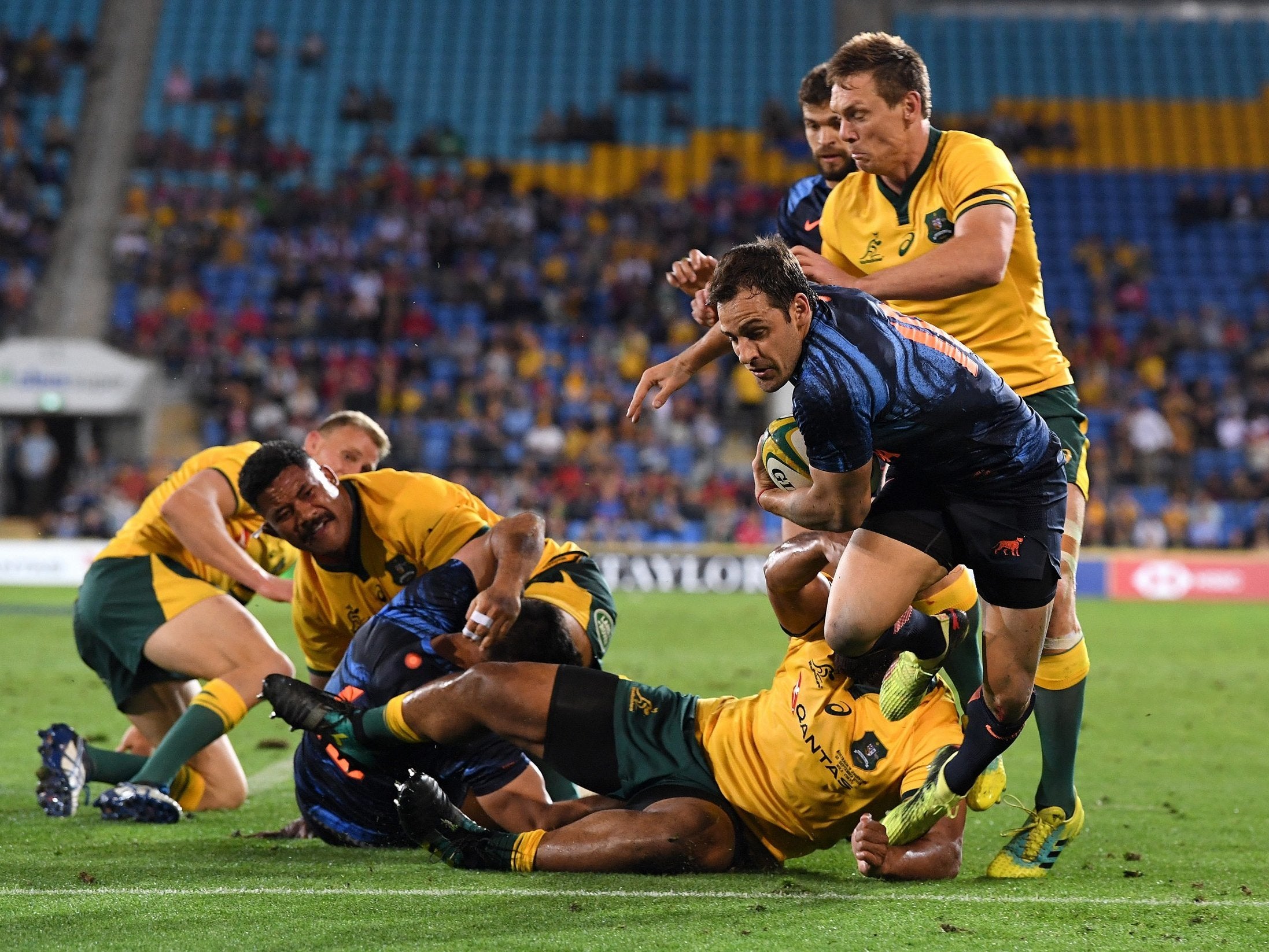 Nicolas Sanchez wriggles free to score a try and help Argentina to victory