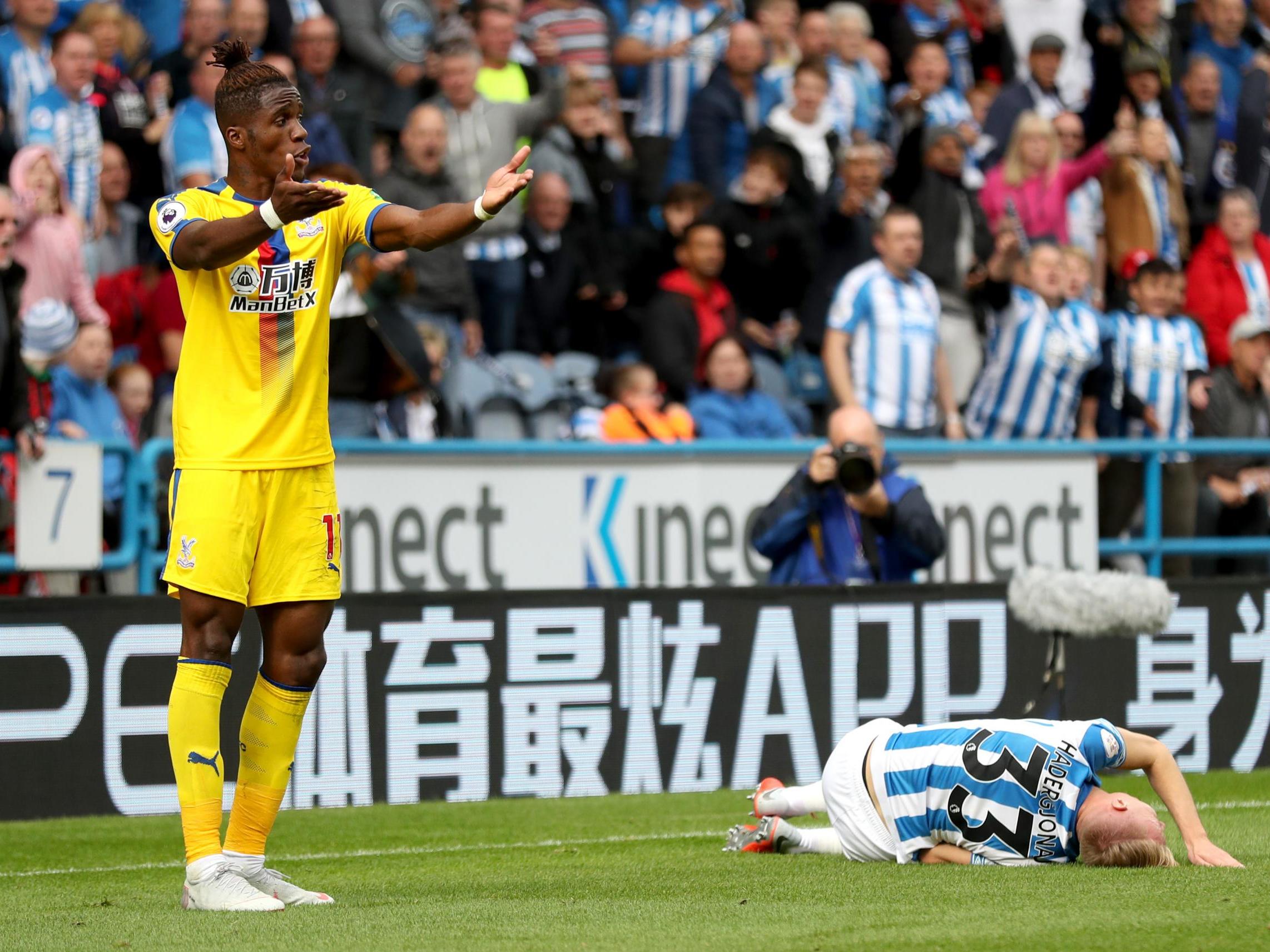 Wilfried Zaha was shown a yellow for his foul on Florent Hadergjonaj