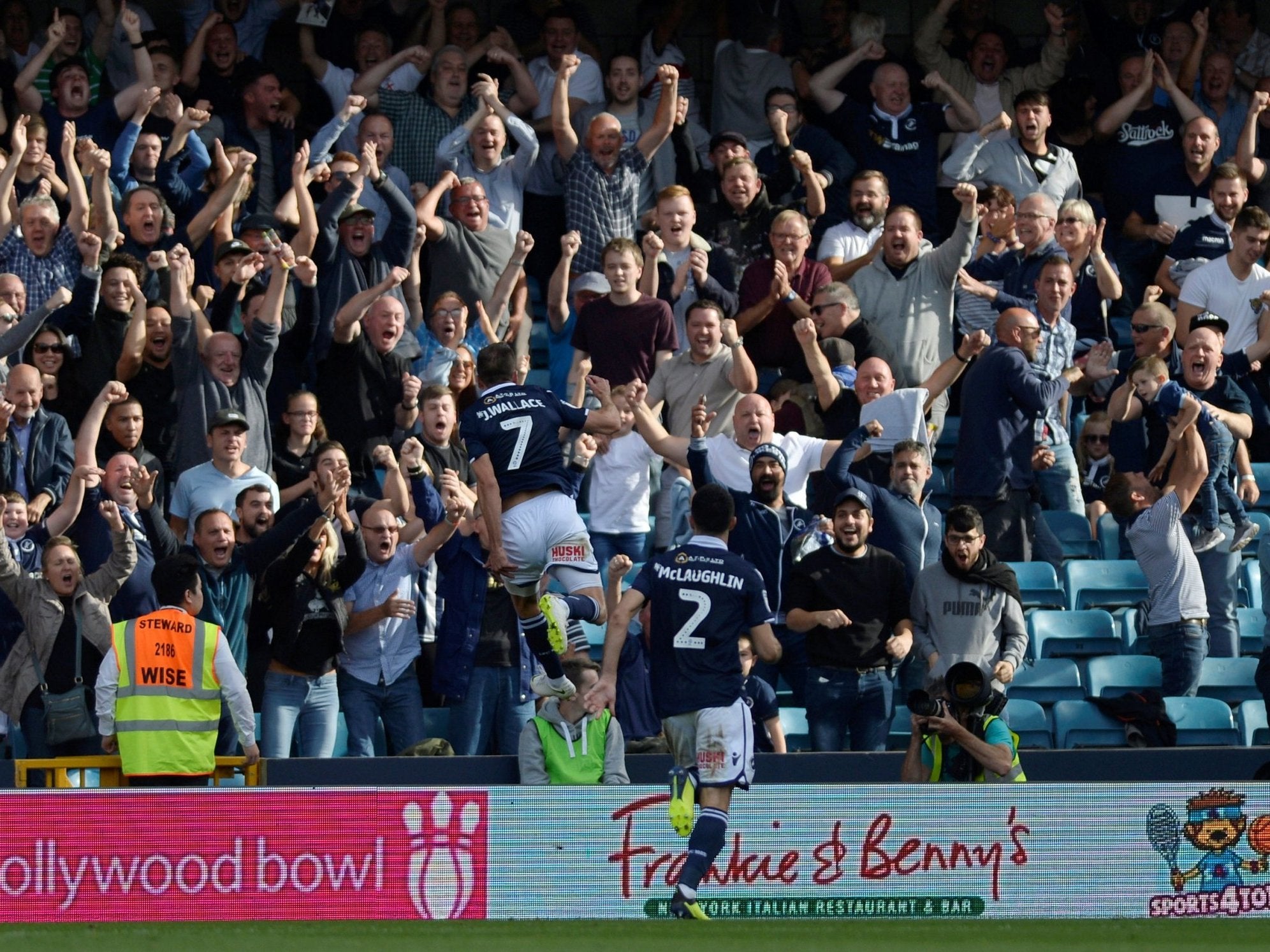 Jed Wallace celebrates in front of the home Millwall fans