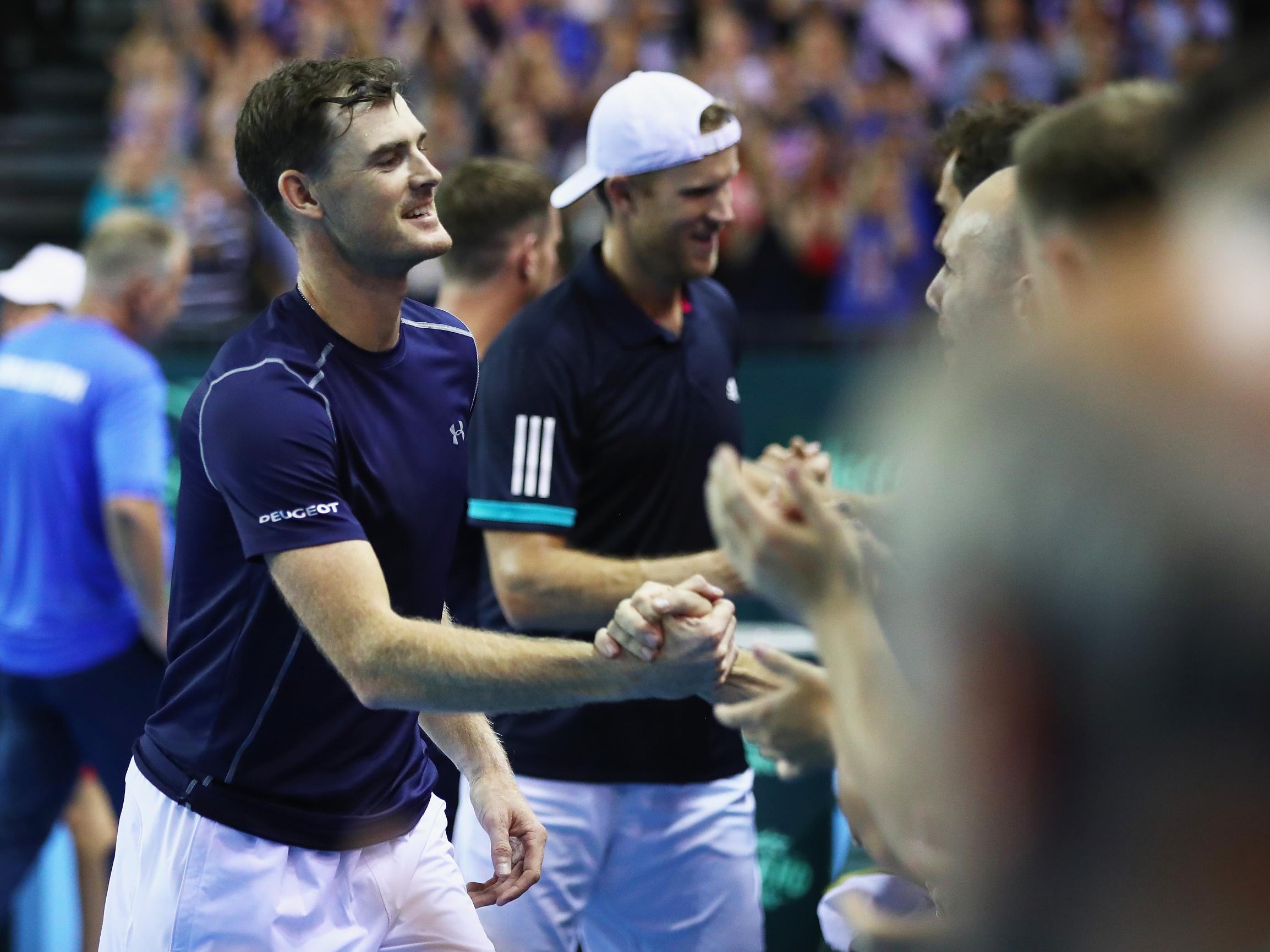 Jamie Murray and Dominic Inglot celebrate with their GB team mates after the victory