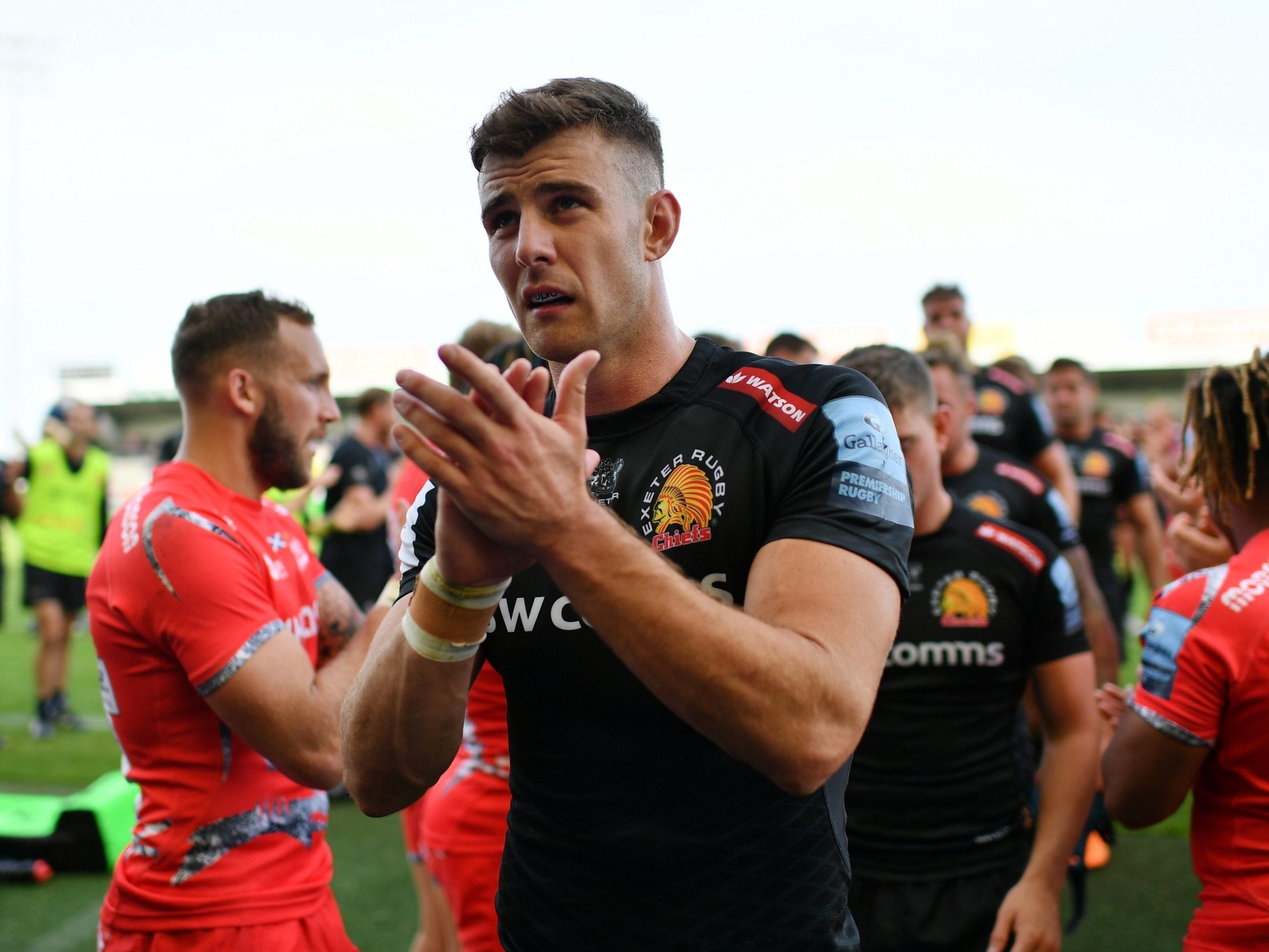 Ollie Devoto applauds the Exeter Chiefs supporters after the victory