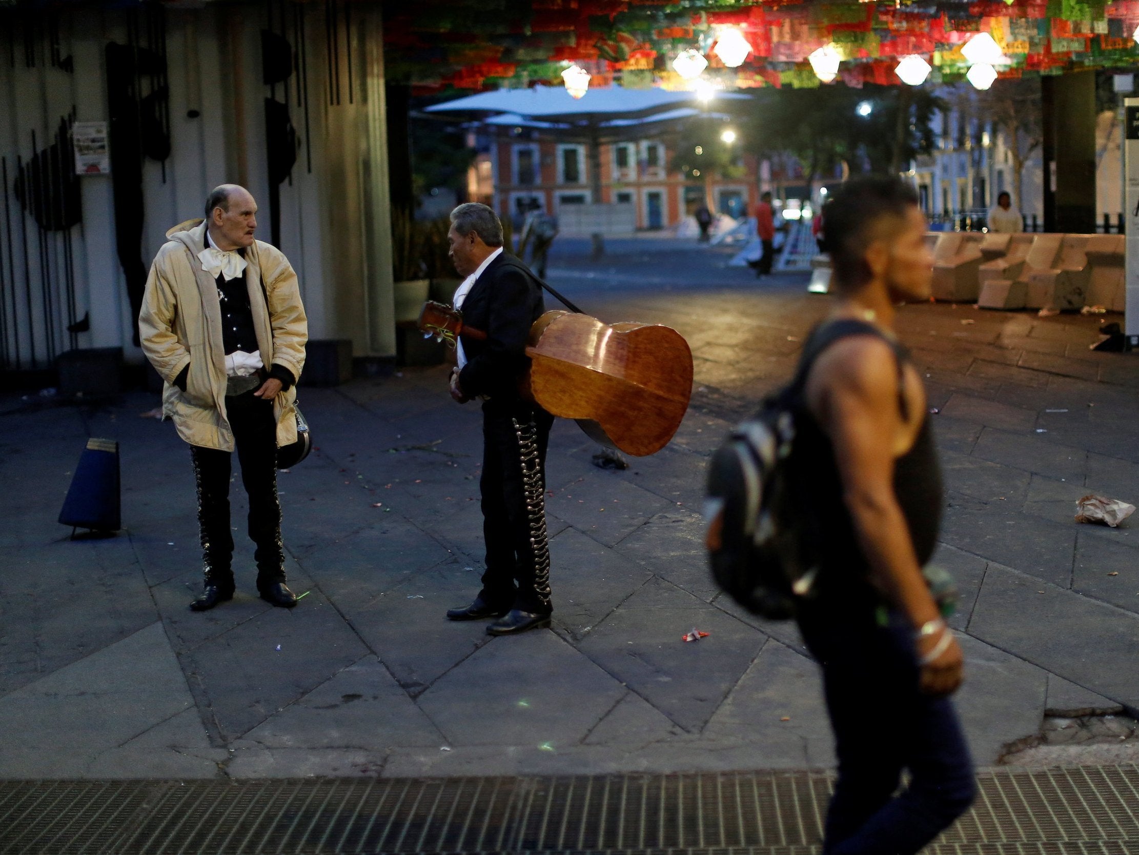 &#13;
Mariachi musicians talk at the tourist Plaza Garibaldi hours after unknown assailants attacked people with rifles and pistols &#13;