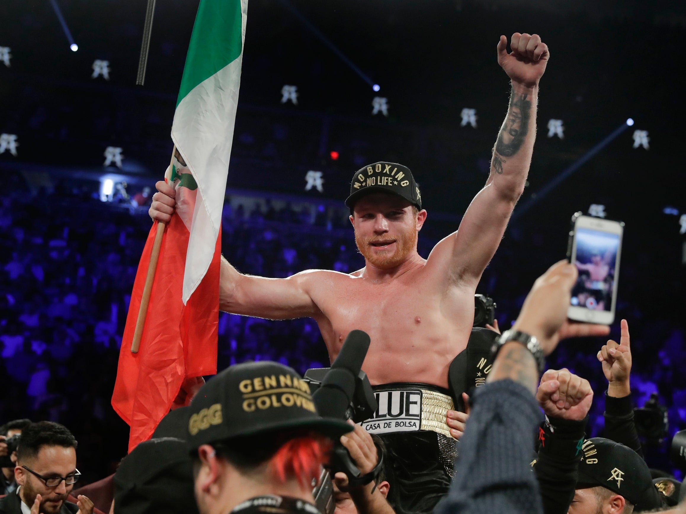 Canelo celebrates his victory which handed Golovkin his first professional defeat