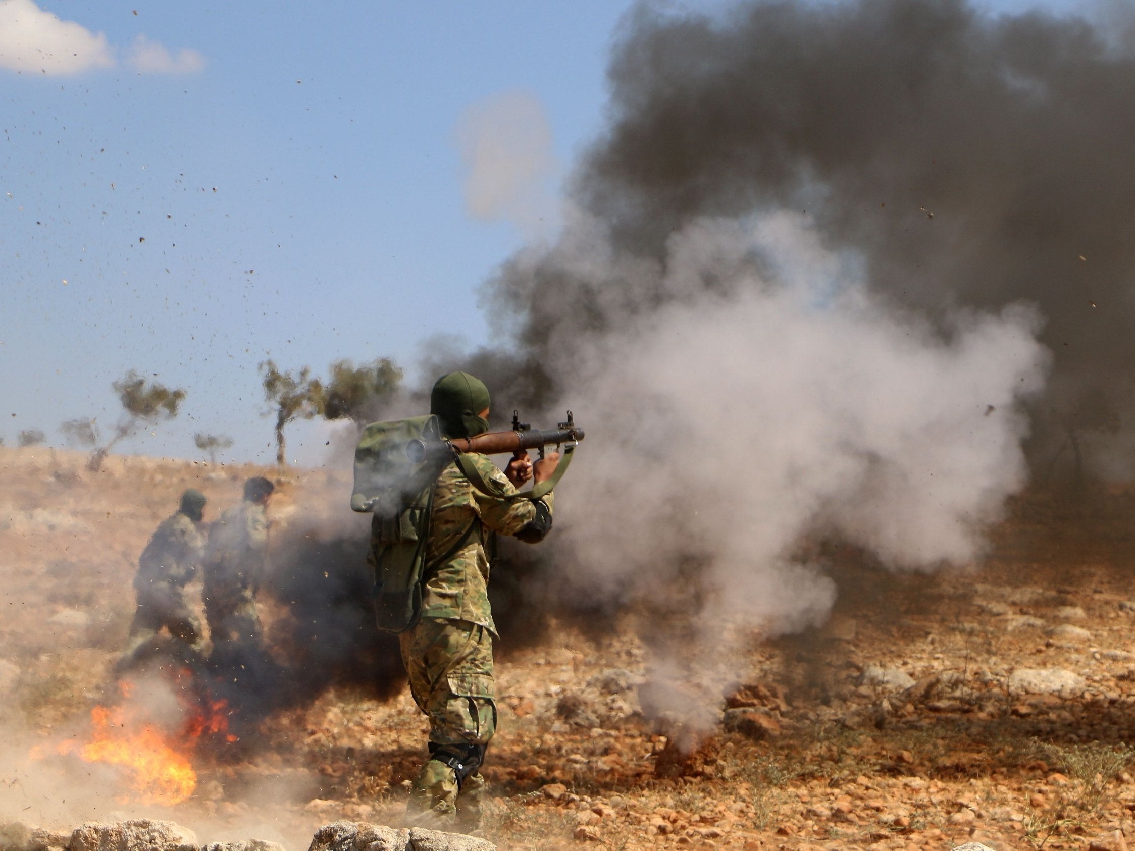 A Syrian rebel fighter takes part in combat training in the northern countryside of the Idlib province on 11 September in anticipation for an upcoming government forces offensive