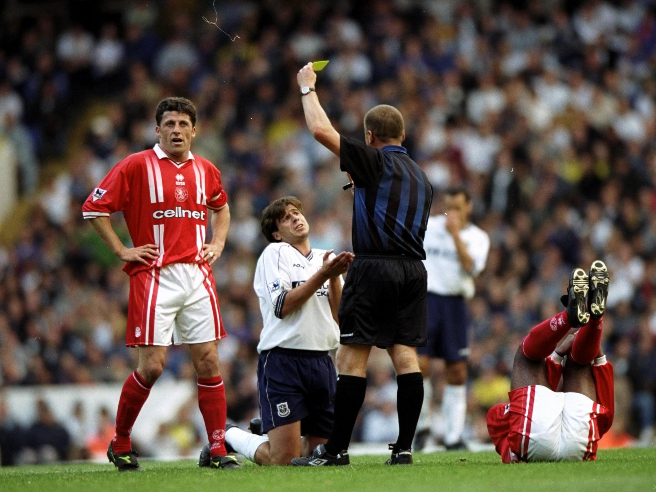 Nicola Berti is booked despite pleading with the referee during a match against Middlesbrough at White Hart Lane