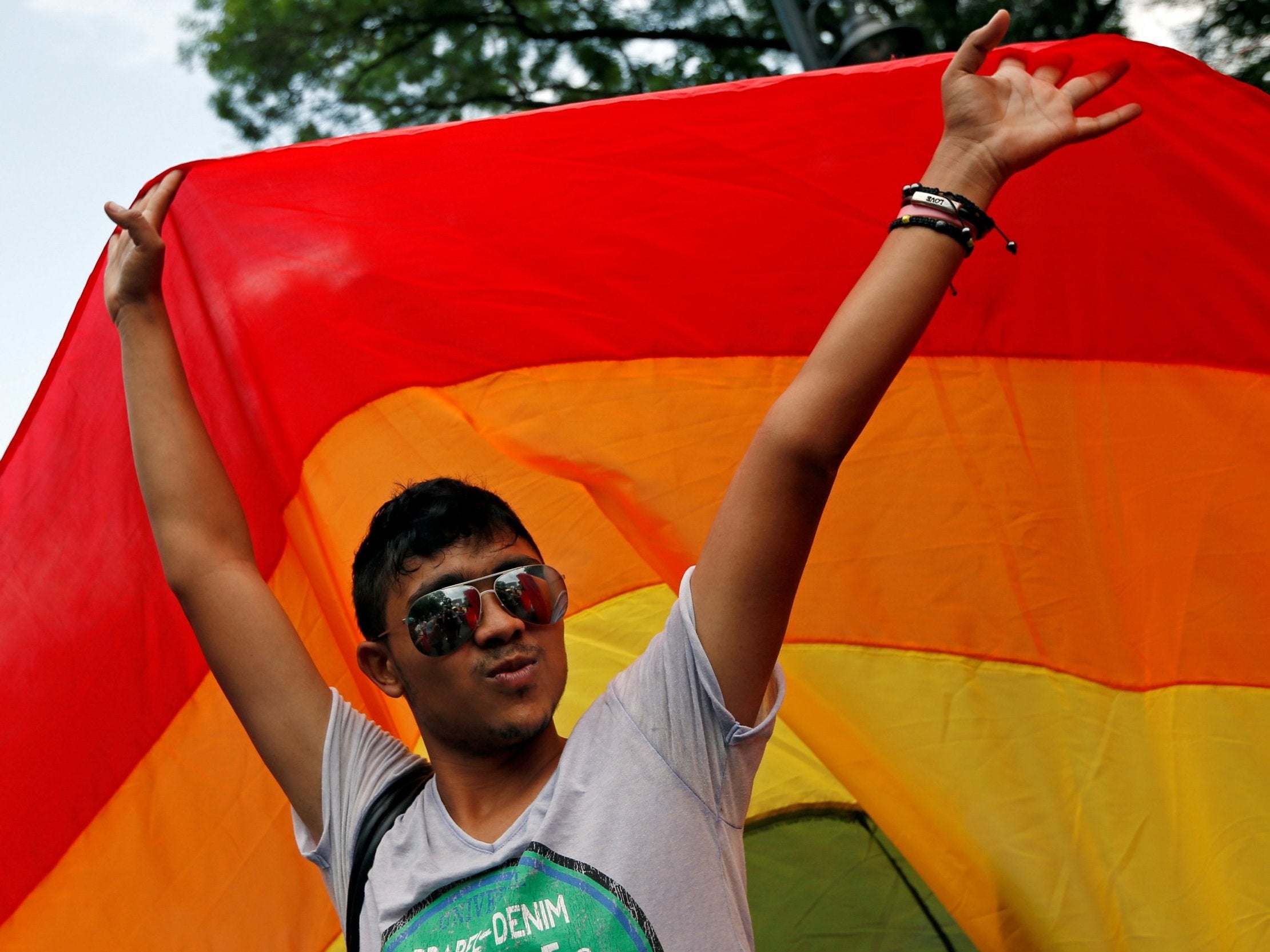 A member of Romania's gay community takes part in the 2014 pride parade in Bucharest