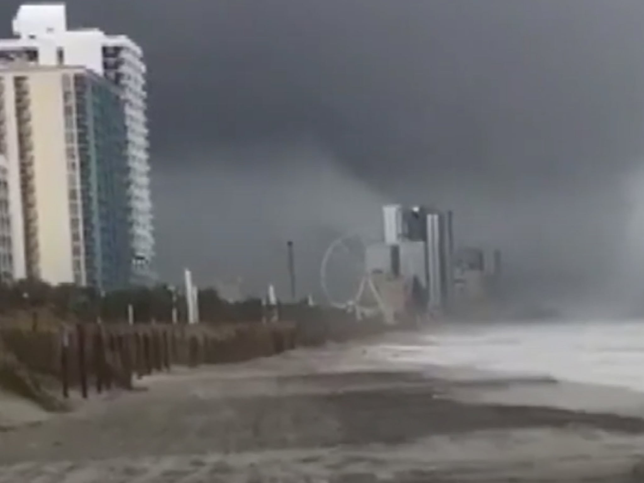 A waterspout turns into a tornado as it makes landfall in Myrtle Beach, South Carolina, just days after tropical storm Florence.