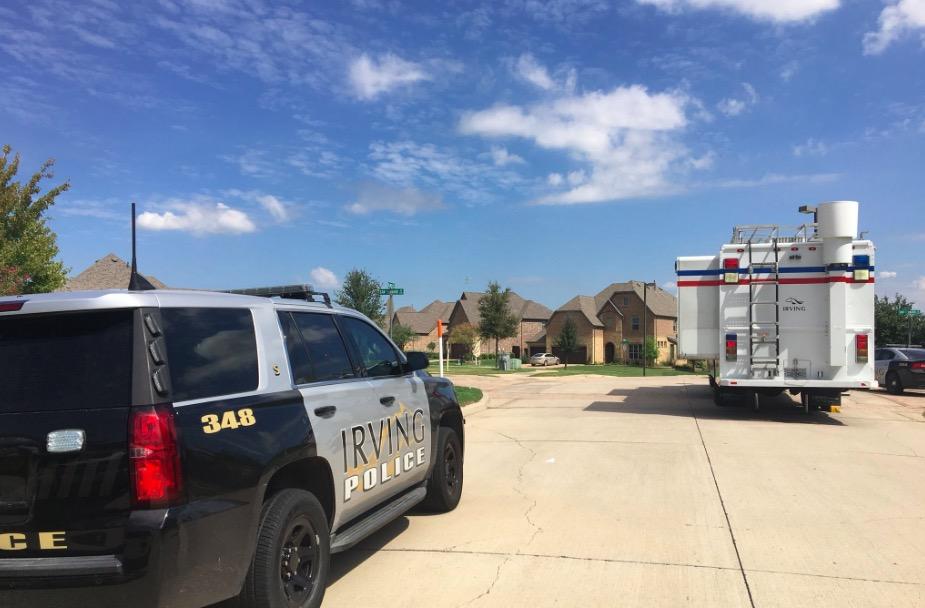 An Irving Police Department vehicle is parked outside of an apparent hostage situation in Irving, Texas 17 September 2018