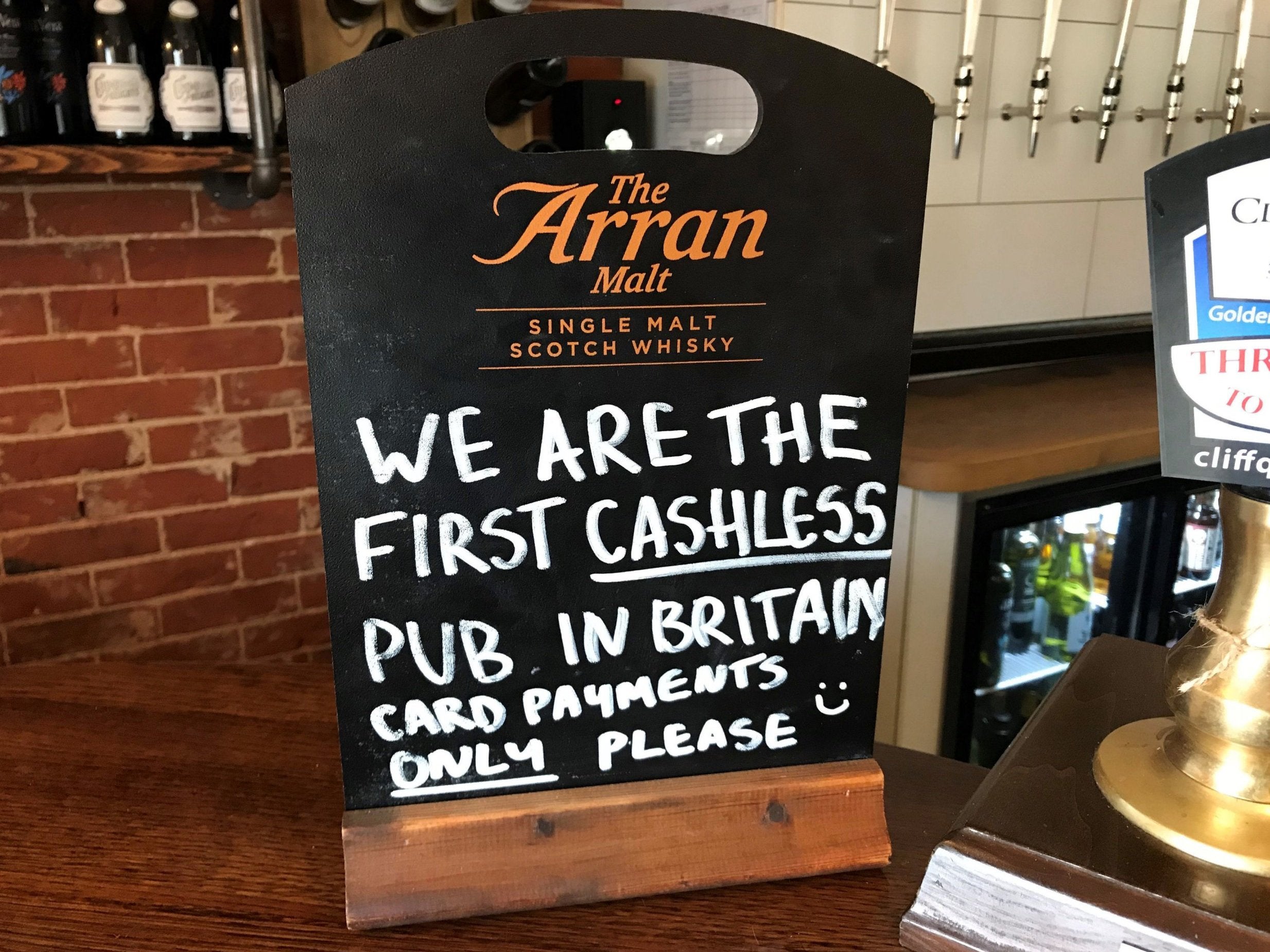 A sign on the bar of the Boot pub in Freston near Ipswich, Suffolk