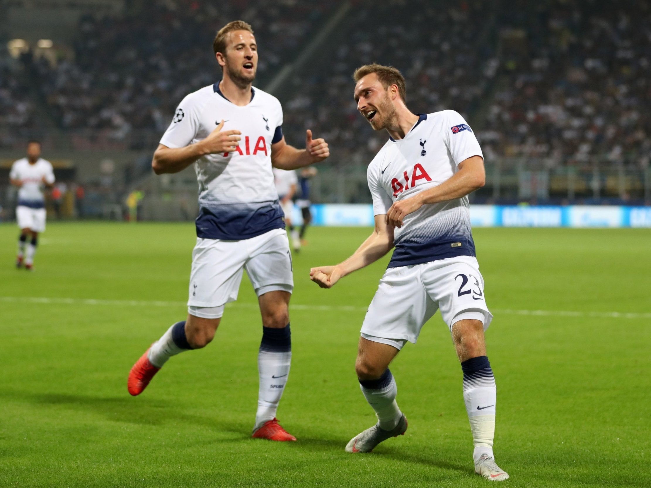 Christian Eriksen celebrates his deflected strike