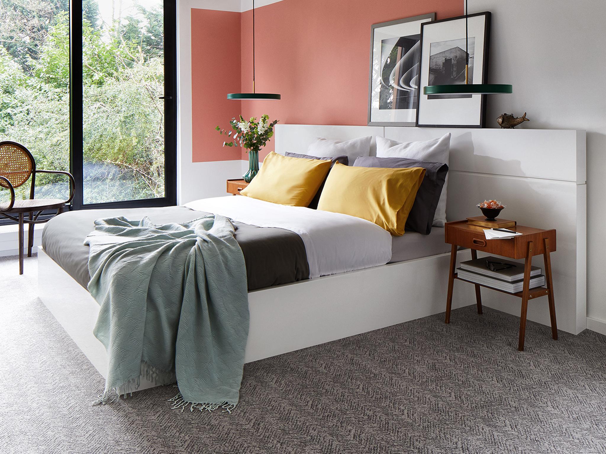 Contrast grey against lighter colours in the bedroom