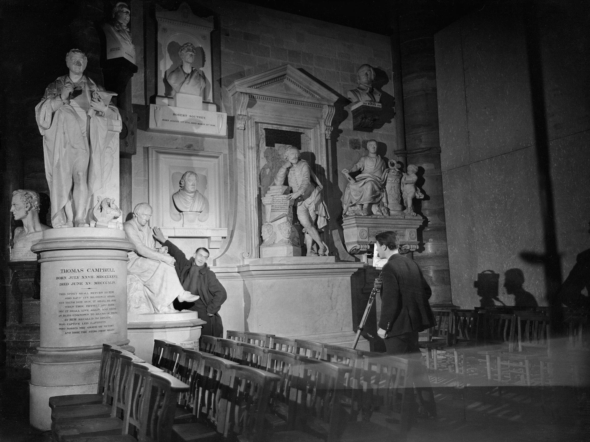 Director Humphrey Jennings (left) with the Crown Film Unit in Poets' Corner, Westminster Abbey, 1941