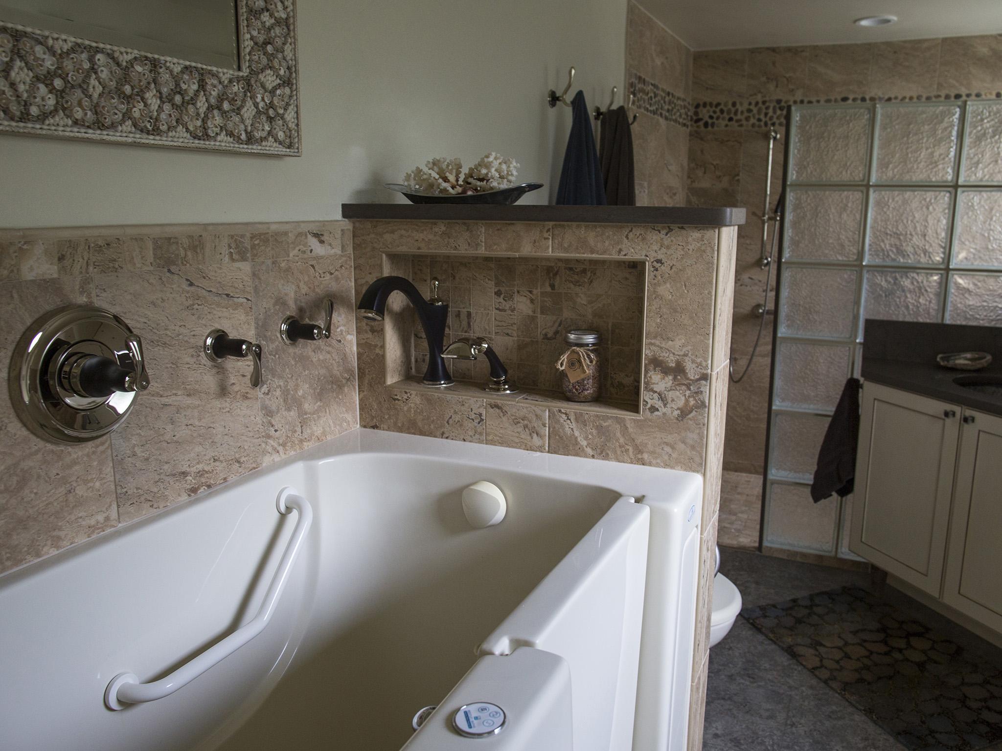 A walk-in bath tub eliminates the need for having to climb in and out