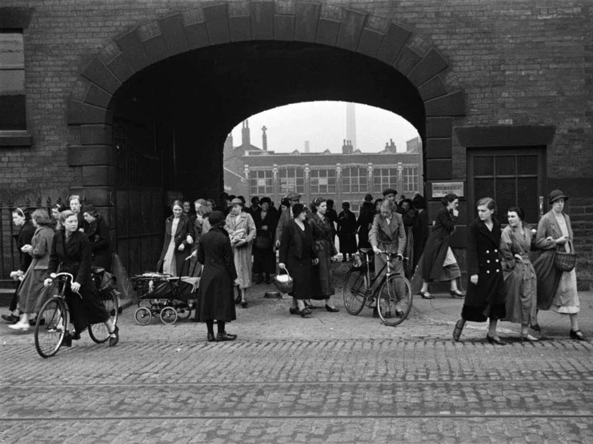 From the Mass-Observation archive: workers leave the Flash Street Mills compound off Great Moor Street in Bolton in 1937