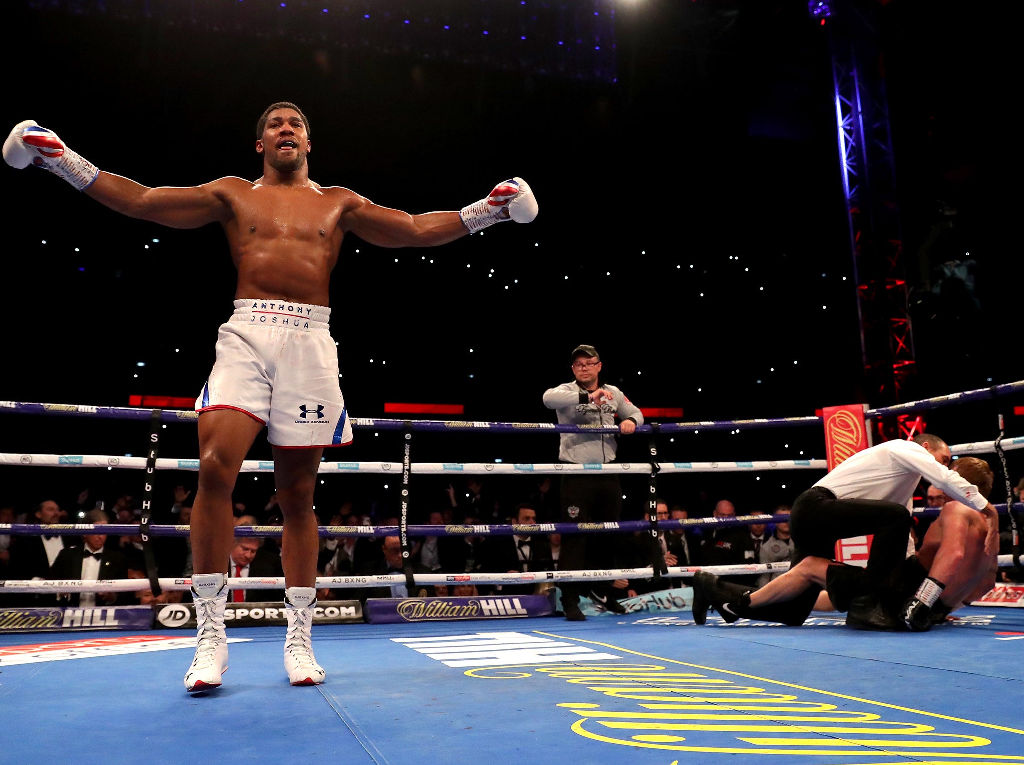 Joshua celebrates after stopping Povetkin