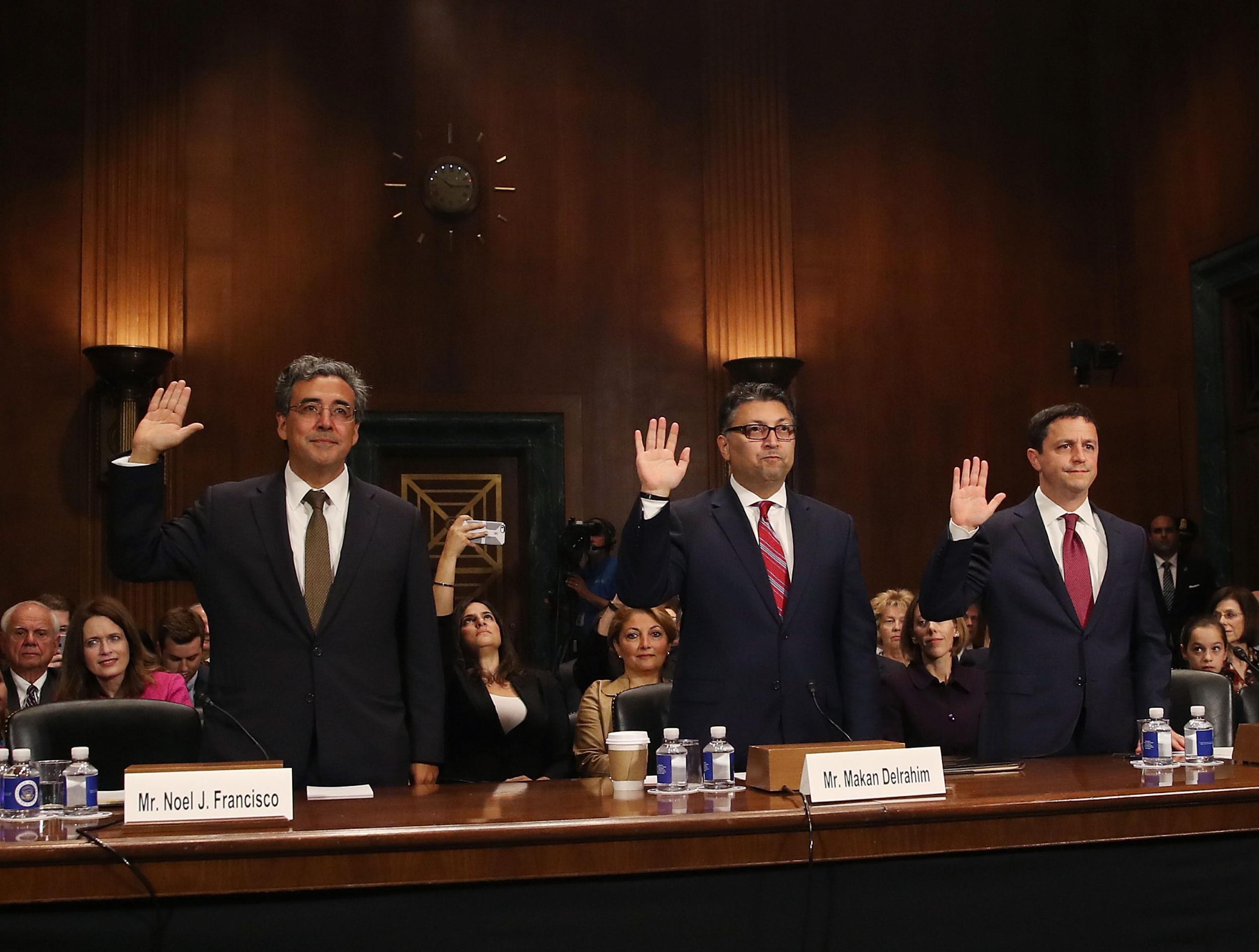 Justice Department nominees, (L-R), Noel Francisco to be Solicitor General, Makan Delrahim to be an assistant attorney general in the Antitrust Division, and Steven Engel to be an assistant attorney general in the Office of Legal Counsel, raise their right hands as they are sworn in during their Senate Judiciary Committee confirmation hearing on Capitol Hill, on 10 May 2017.