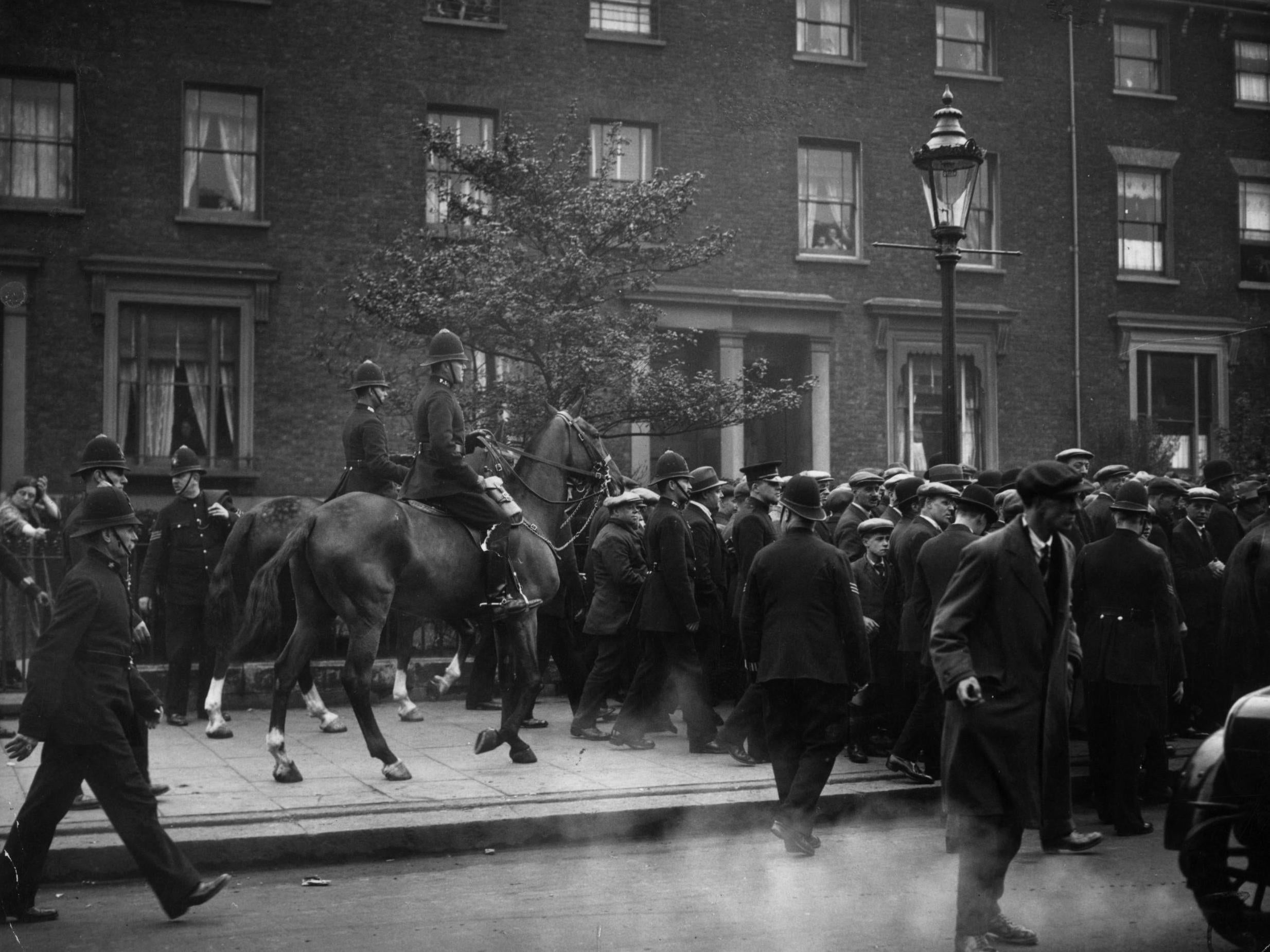 Mounted police clearing the streets in New Cross, London, during the general strike