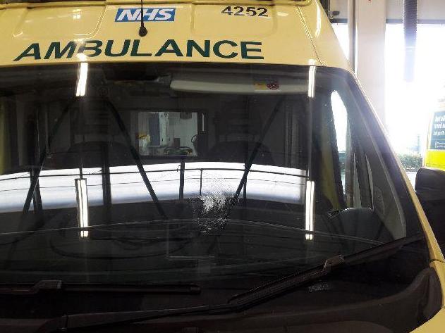 An ambulance with a broken windscreen after a brick attack in Birmingham