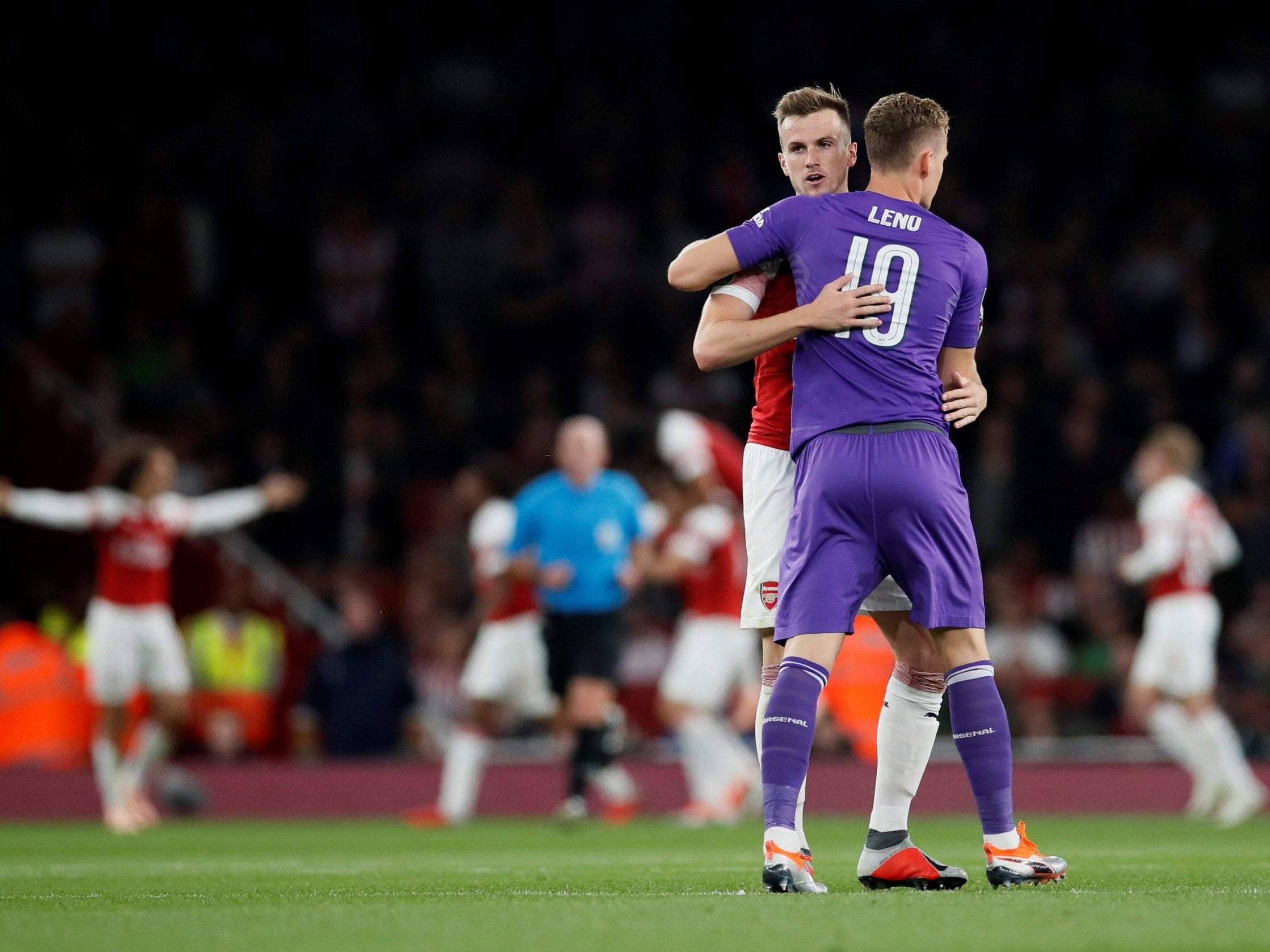 Rob Holding celebrates with Bernd Leno (Reuters)