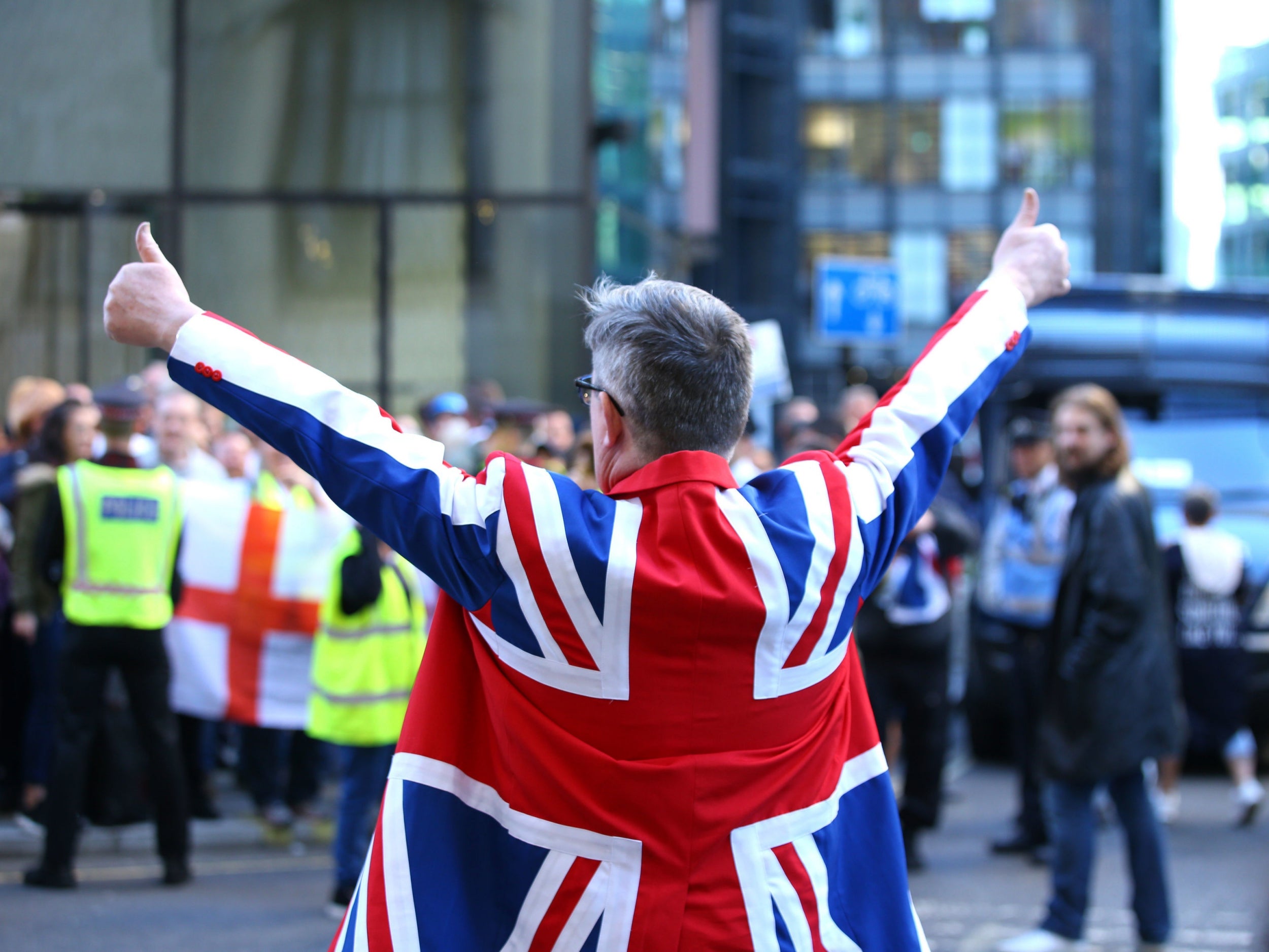 A Tommy Robinson supporter outside the Old Bailey in London where the former English Defence League (EDL) leader is accused of contempt of court