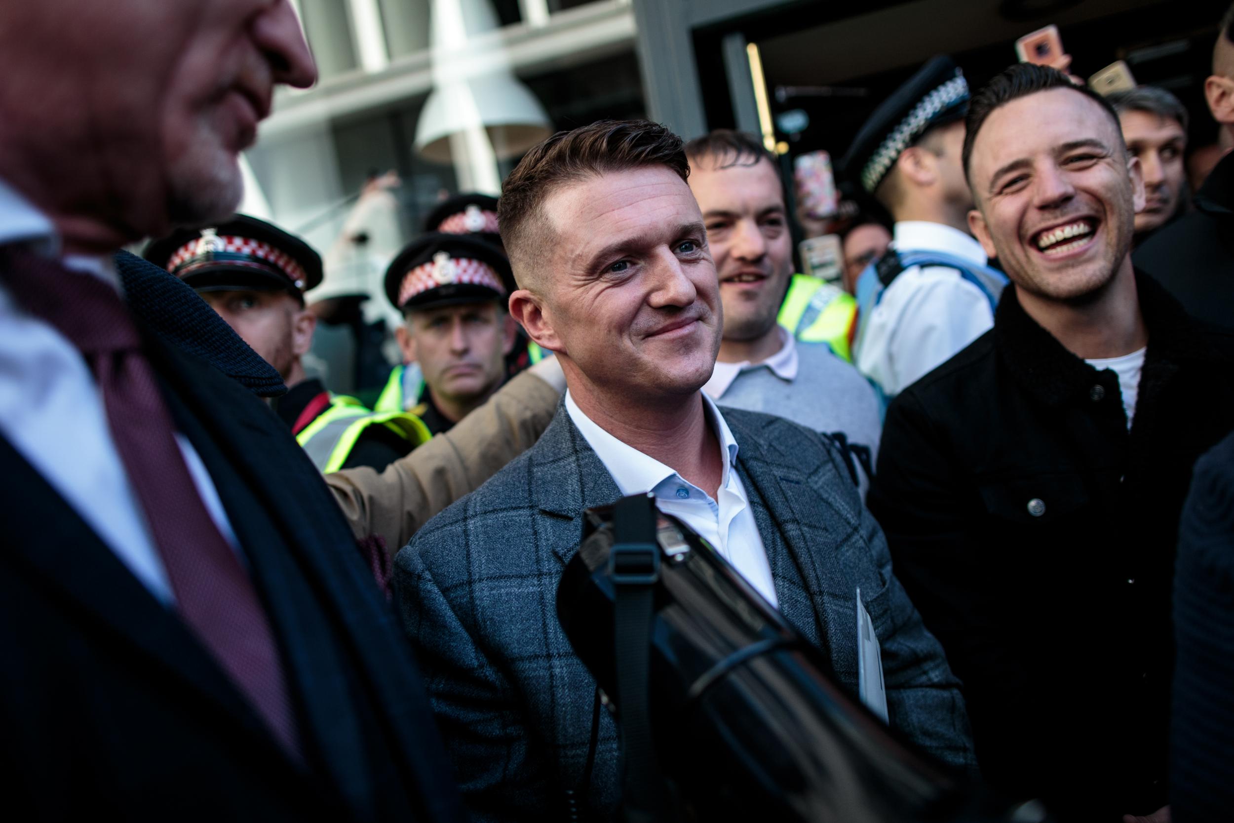 Tommy Robinson being greeted by supporters after a contempt hearing was adjourned at the Old Bailey on 27 September