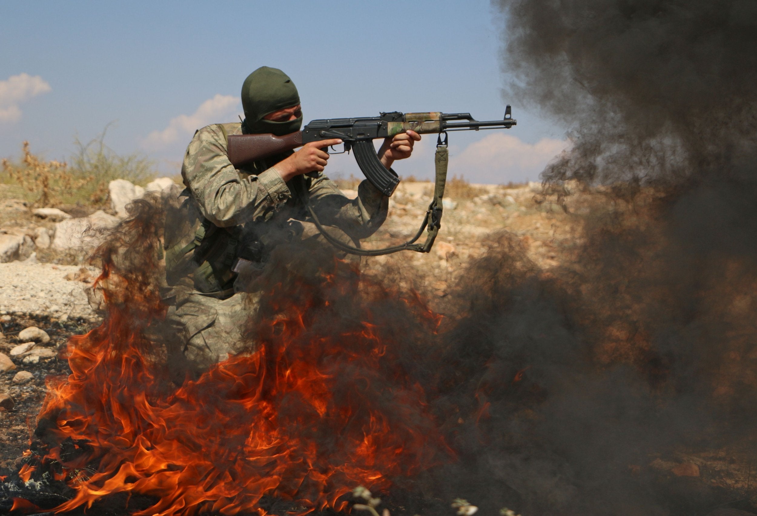 A Syrian rebel fighter from the recently-formed 'National Liberation Front' takes part in combat training in Idlib province on 11 September