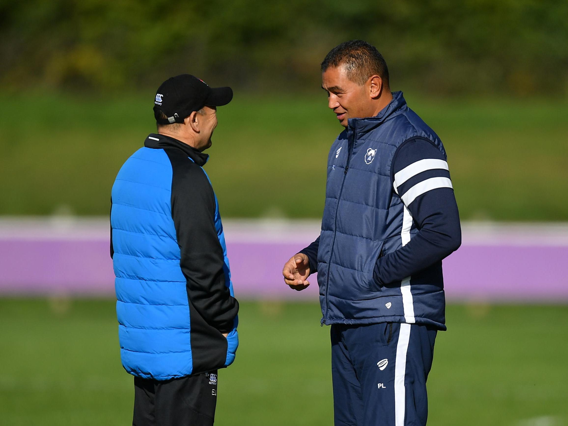 Lam (right) speaks with England head coach Eddie Jones this week in Bristol