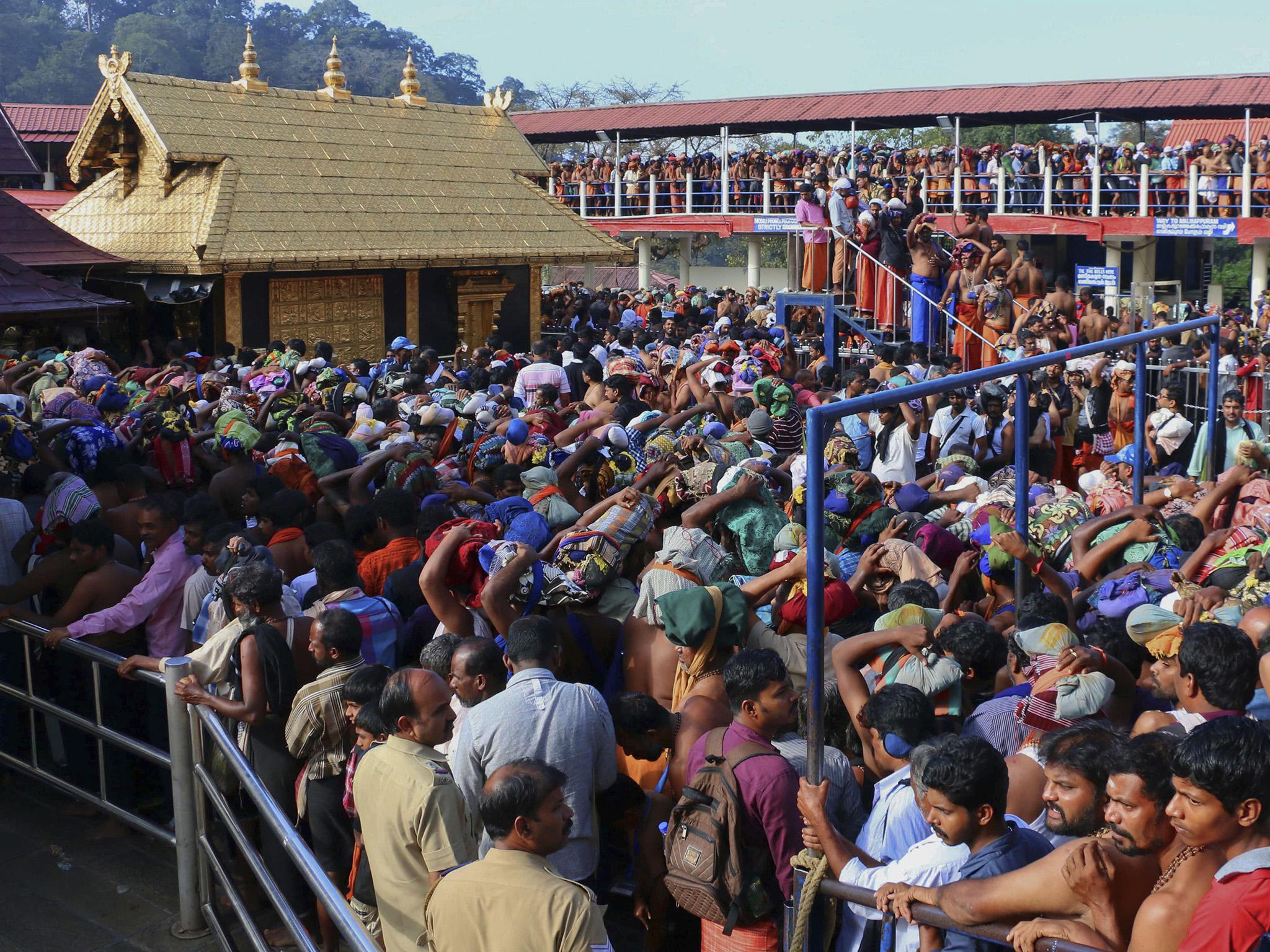 Hindu worshippers queue during a pilgrimage at the Sabarimala temple in the southern Indian state of Kerala