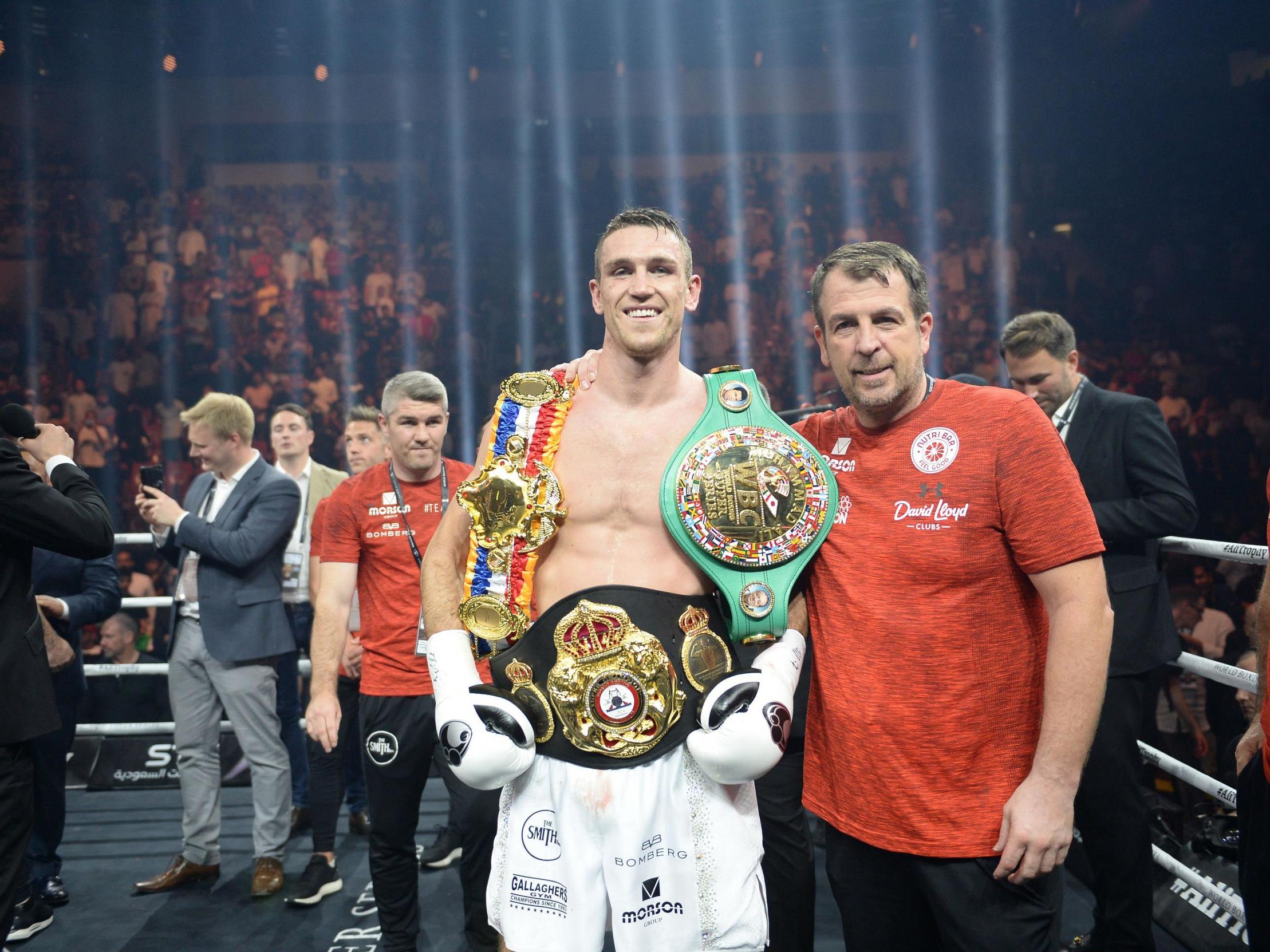 Smith with his trinkets after victory on Friday night