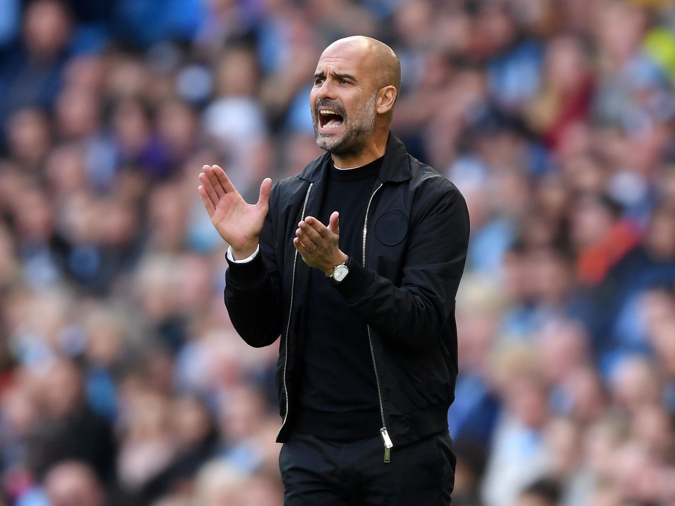 Pep Guardiola issues instructions during his side’s clash