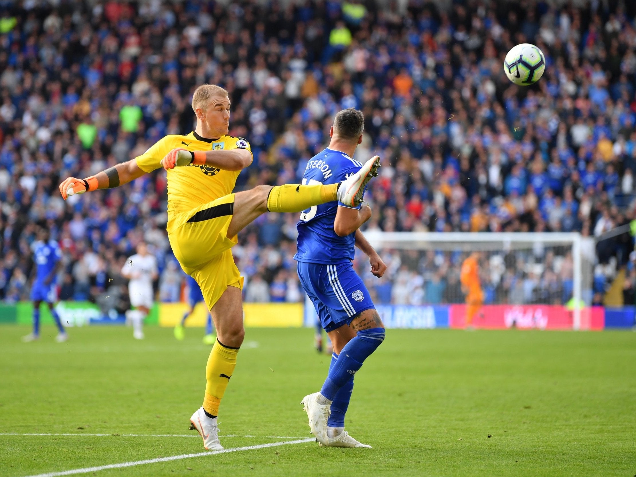 Joe Hart leaves his goal to make a clearance