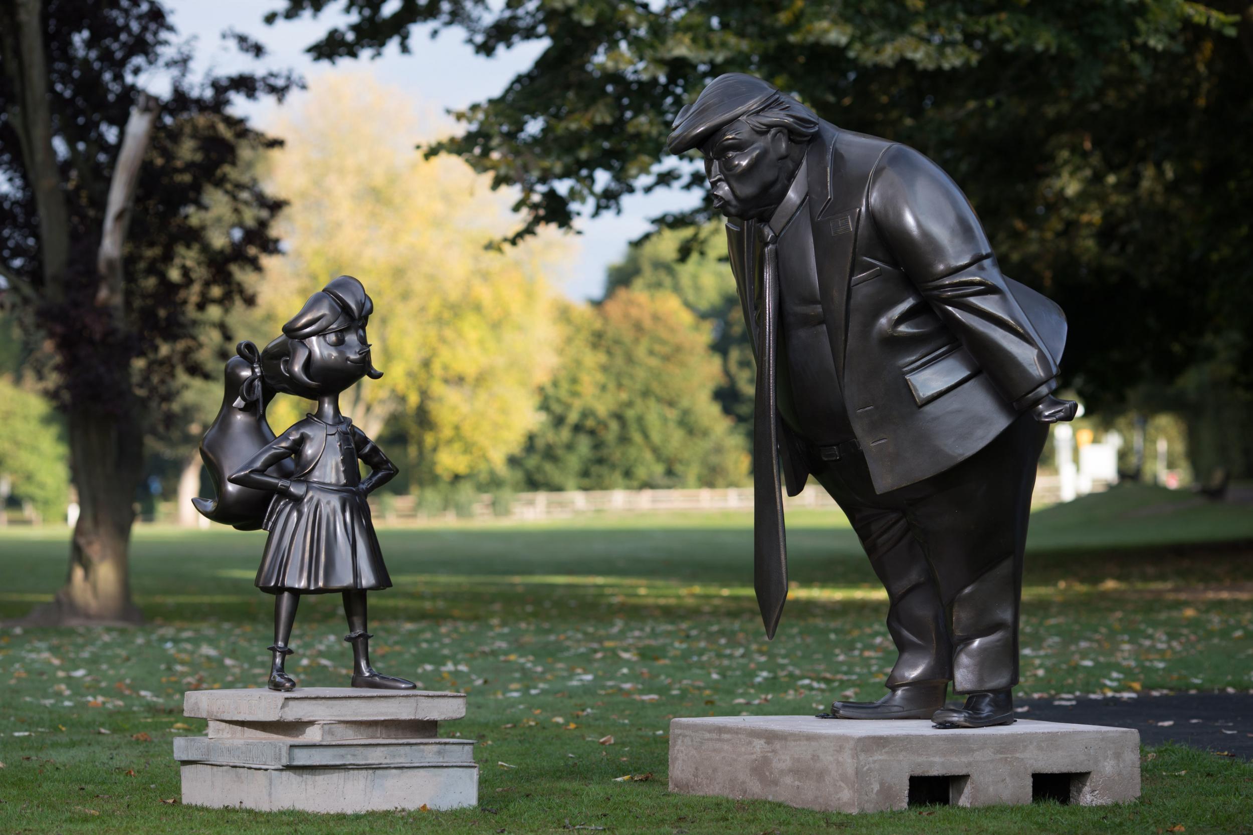 A statue of Roald Dahl's Matilda is unveiled in Great Missenden in Buckinghamshire, alongside one of President Donald Trump, to celebrate the 30th Anniversary of Matilda the novel.