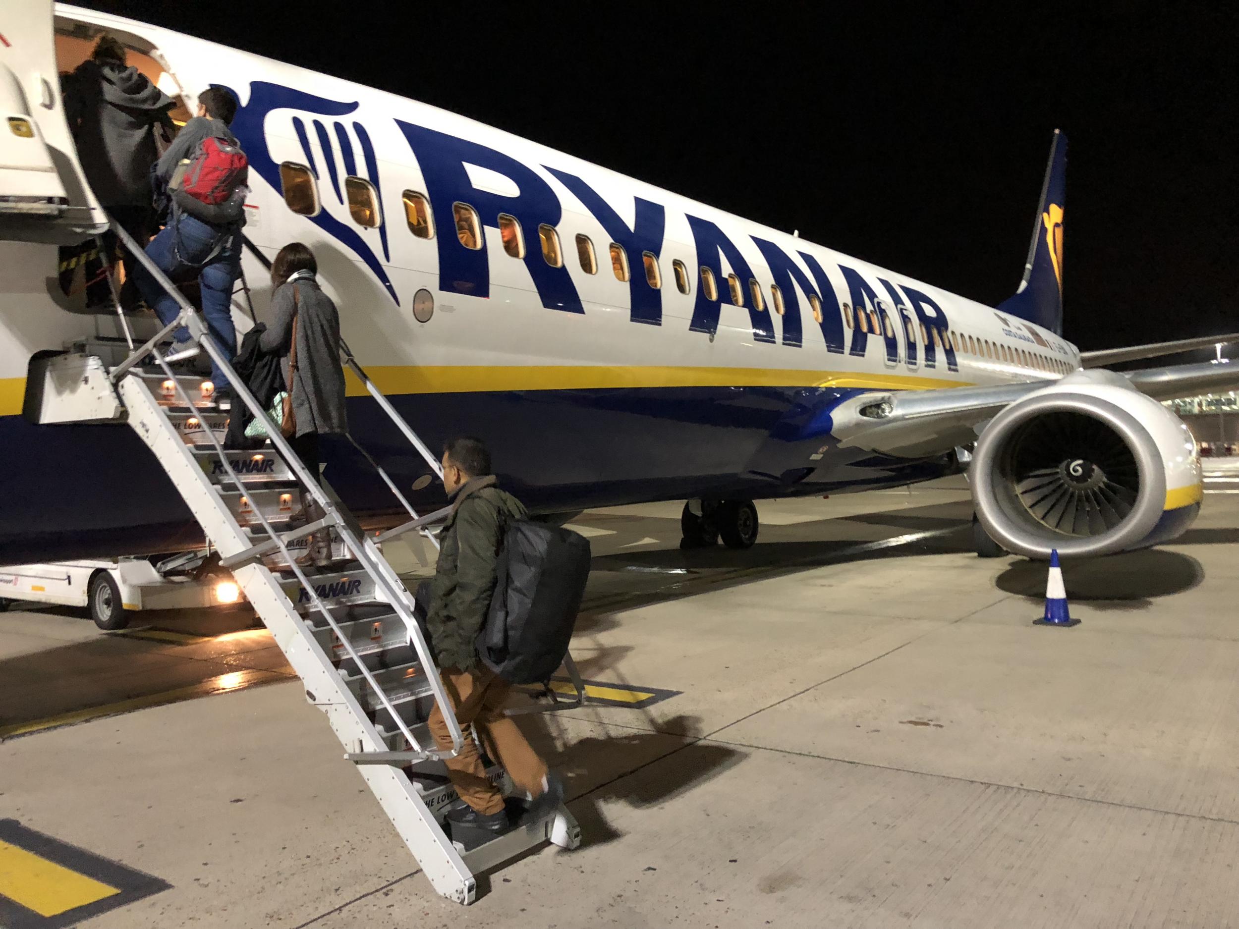 Dwindling demand? Passengers boarding a late-evening Ryanair flight from Stansted, the airline's main base