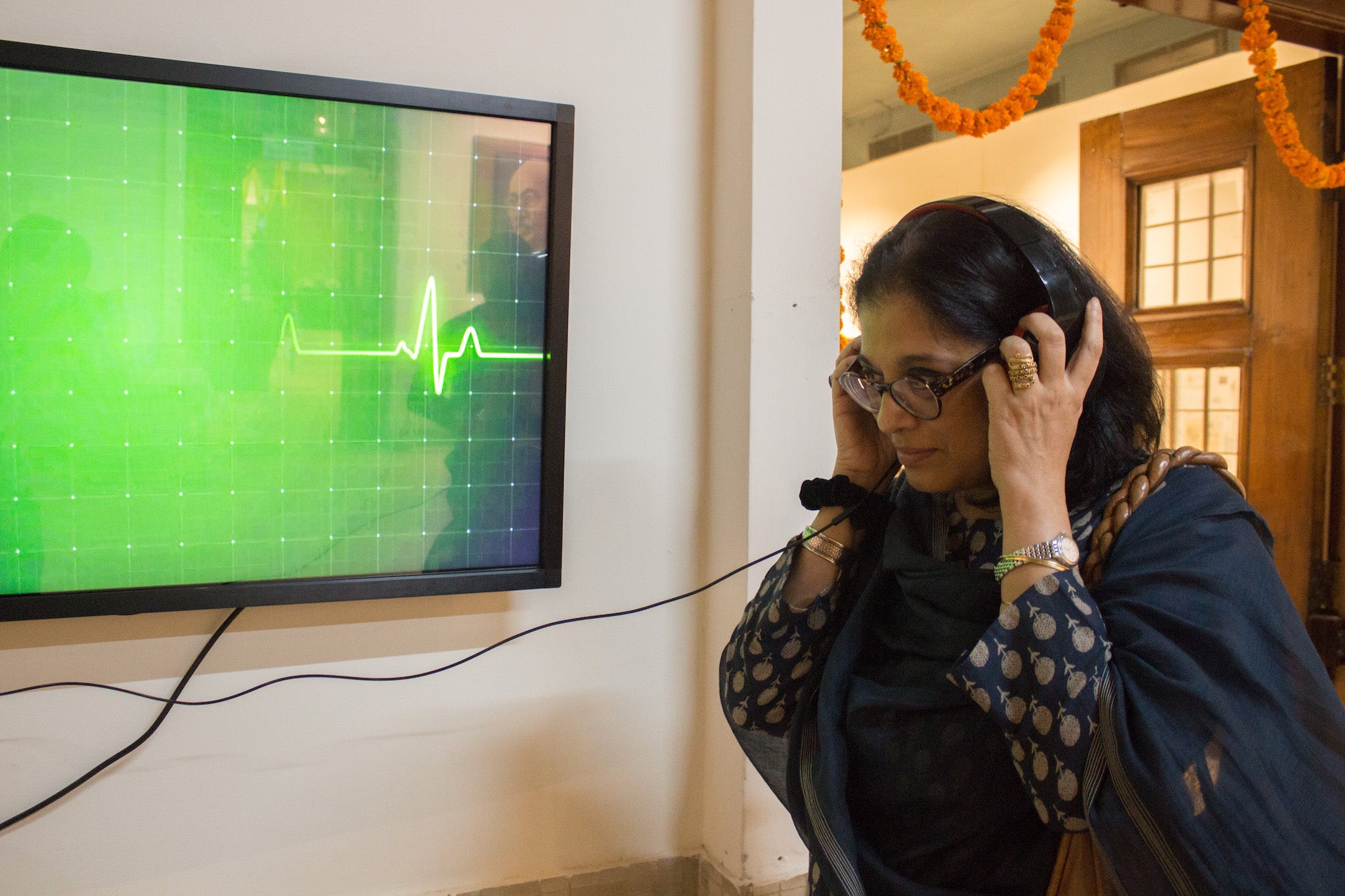 Gandhi’s great-granddaughter, Sukanya Bharatram, listens to his heartbeat