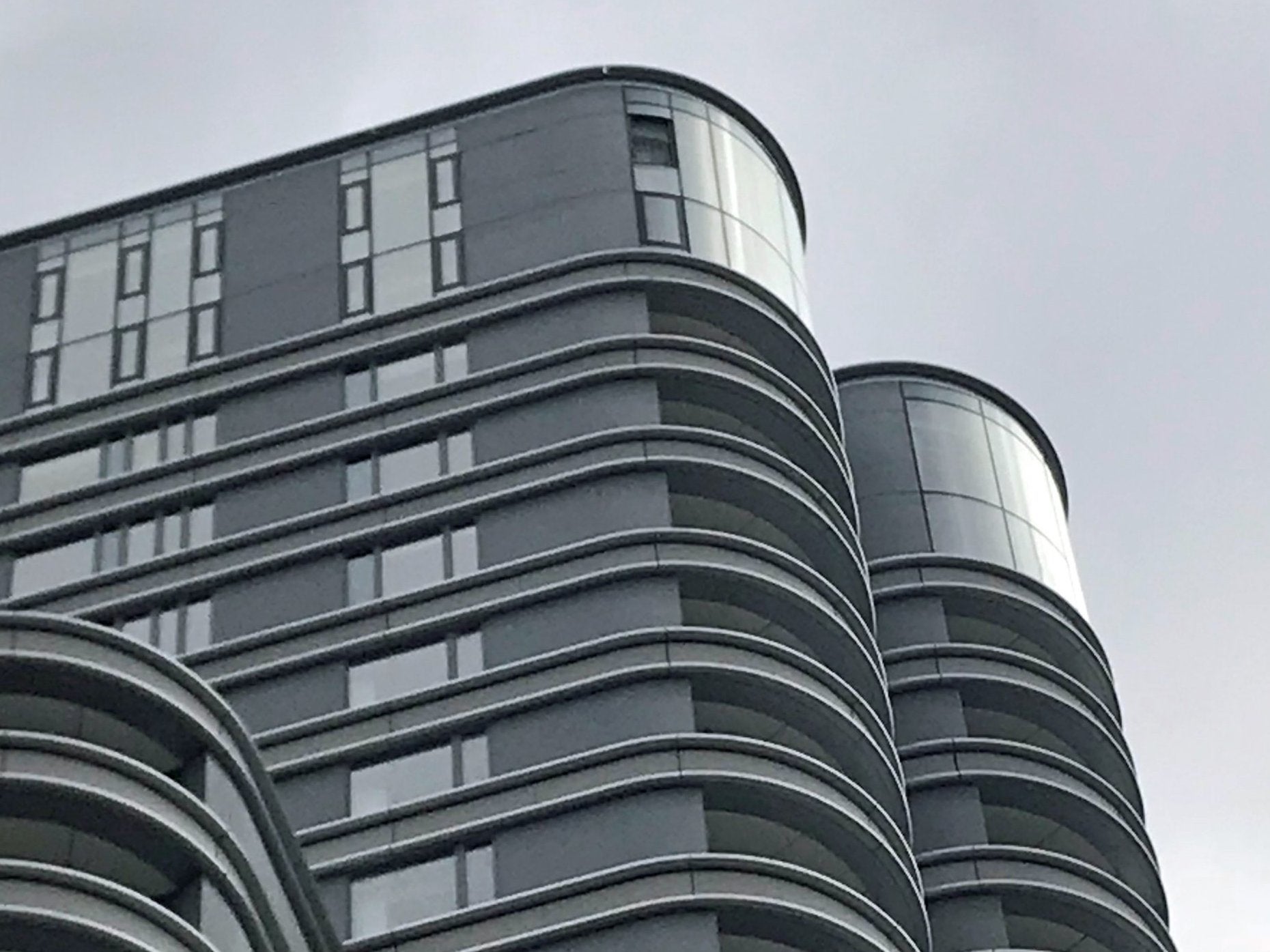 A missing window on the top floor of The Corniche, a luxury block of flats